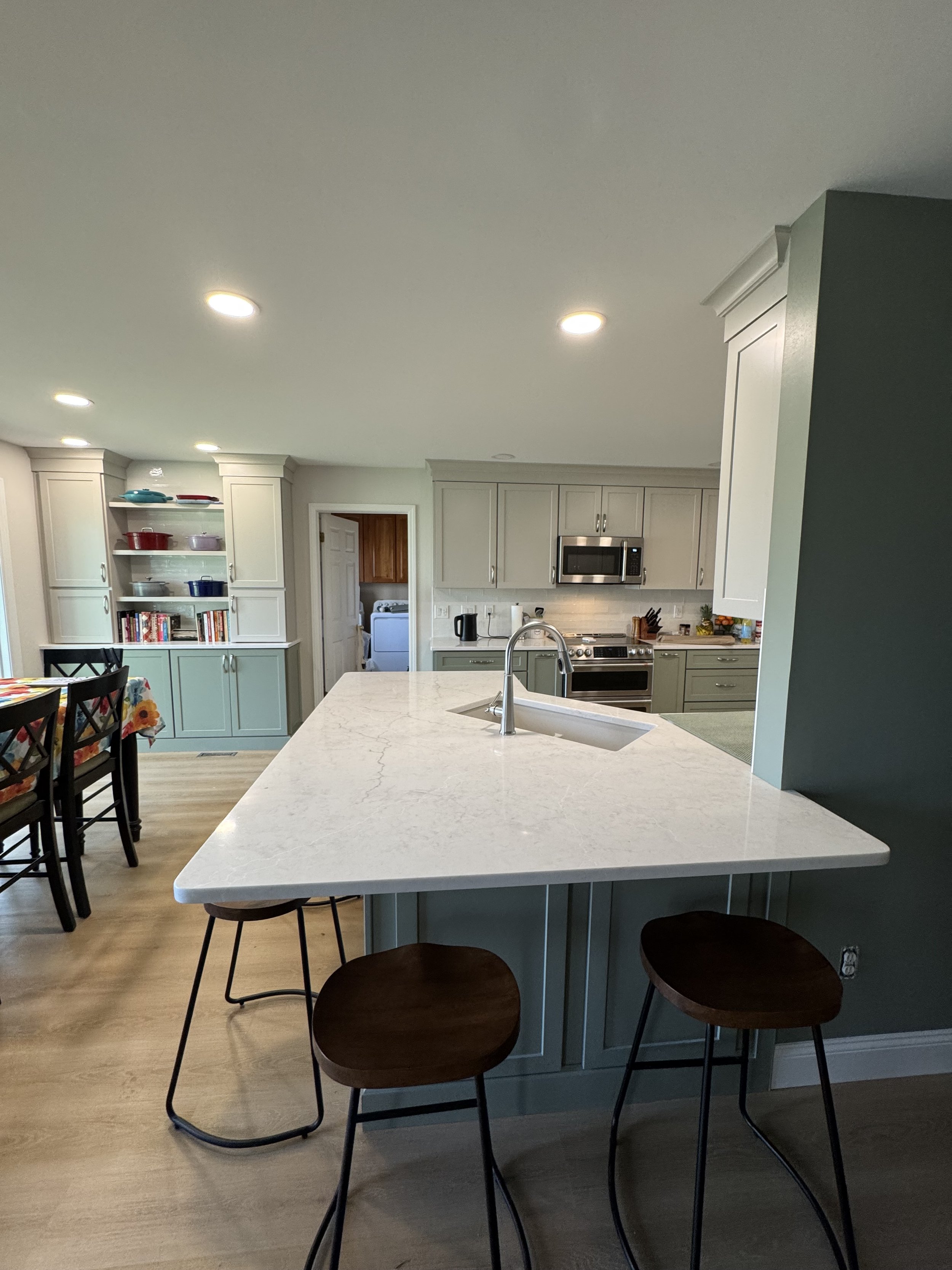 First Floor Remodel - Spring 2025 - Legend Cabinetry, Calacatta Miraggio Cove Quartz, Tile backsplash, MSI Valleyview Grove flooring