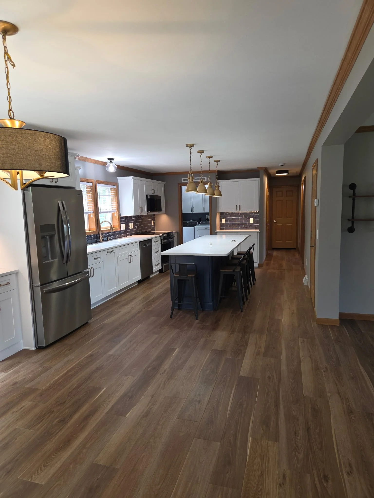 First Floor Remodel - Spring 2025 - Ocean Blue and White cabinetry, Shaw LVP flooring, MSI Quartz, Tile backsplash, Delta Touch Faucet