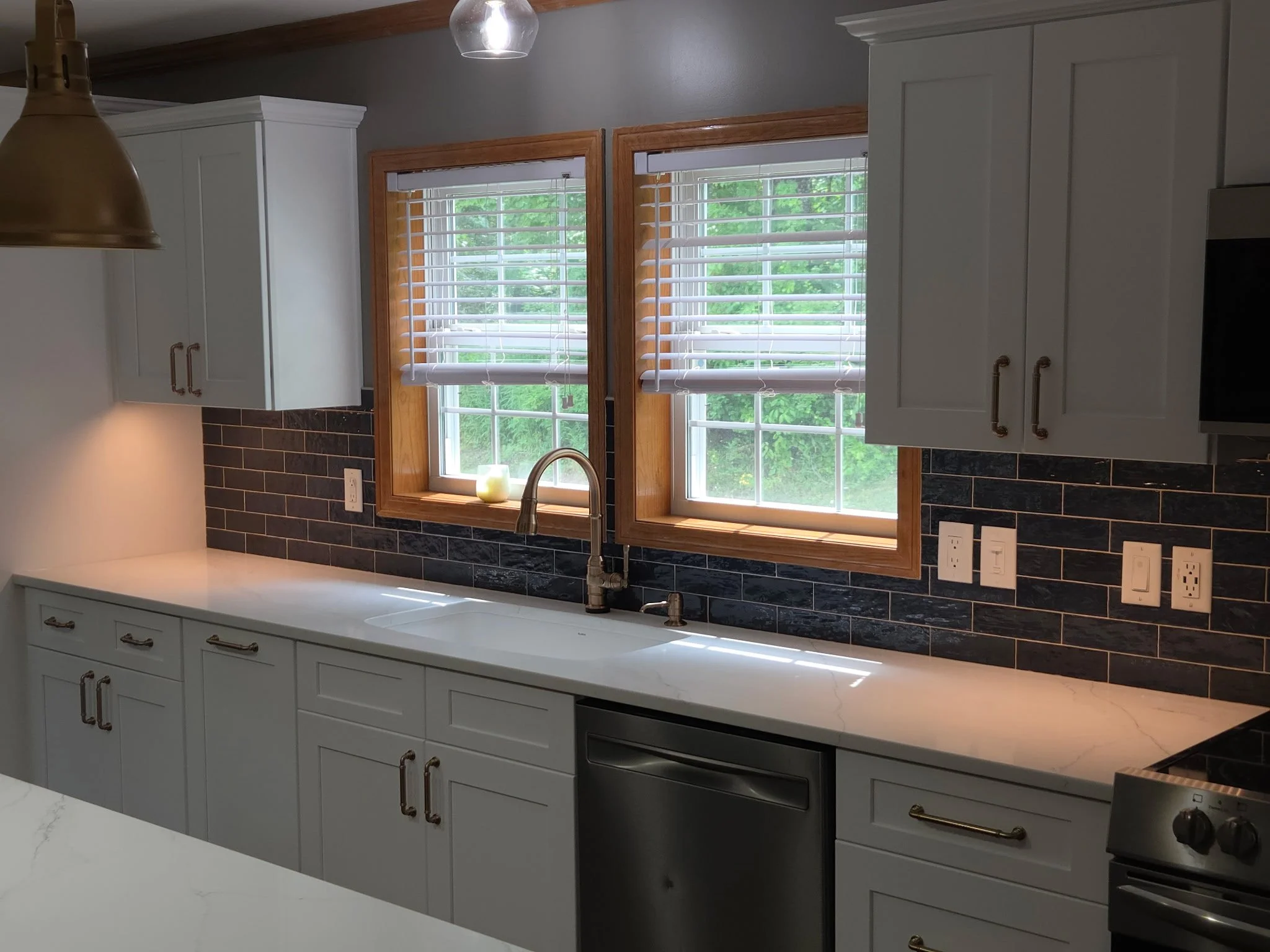 First Floor Remodel - Spring 2025 - Ocean Blue and White cabinetry, Shaw LVP flooring, MSI Quartz, Tile backsplash, Delta Touch Faucet