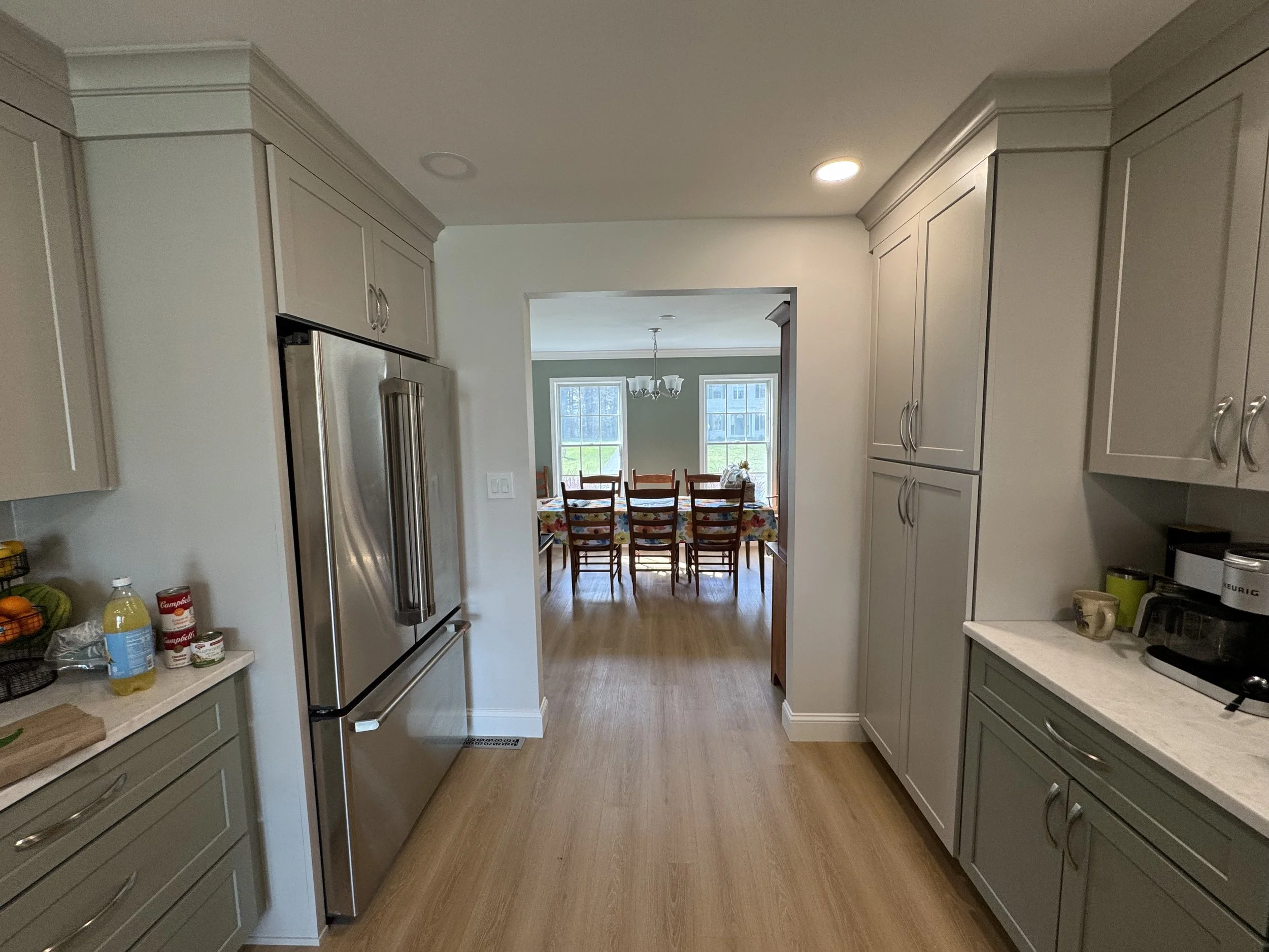 First Floor Remodel - Spring 2025 - Legend Cabinetry, Calacatta Miraggio Cove Quartz, Tile backsplash, MSI Valleyview Grove flooring