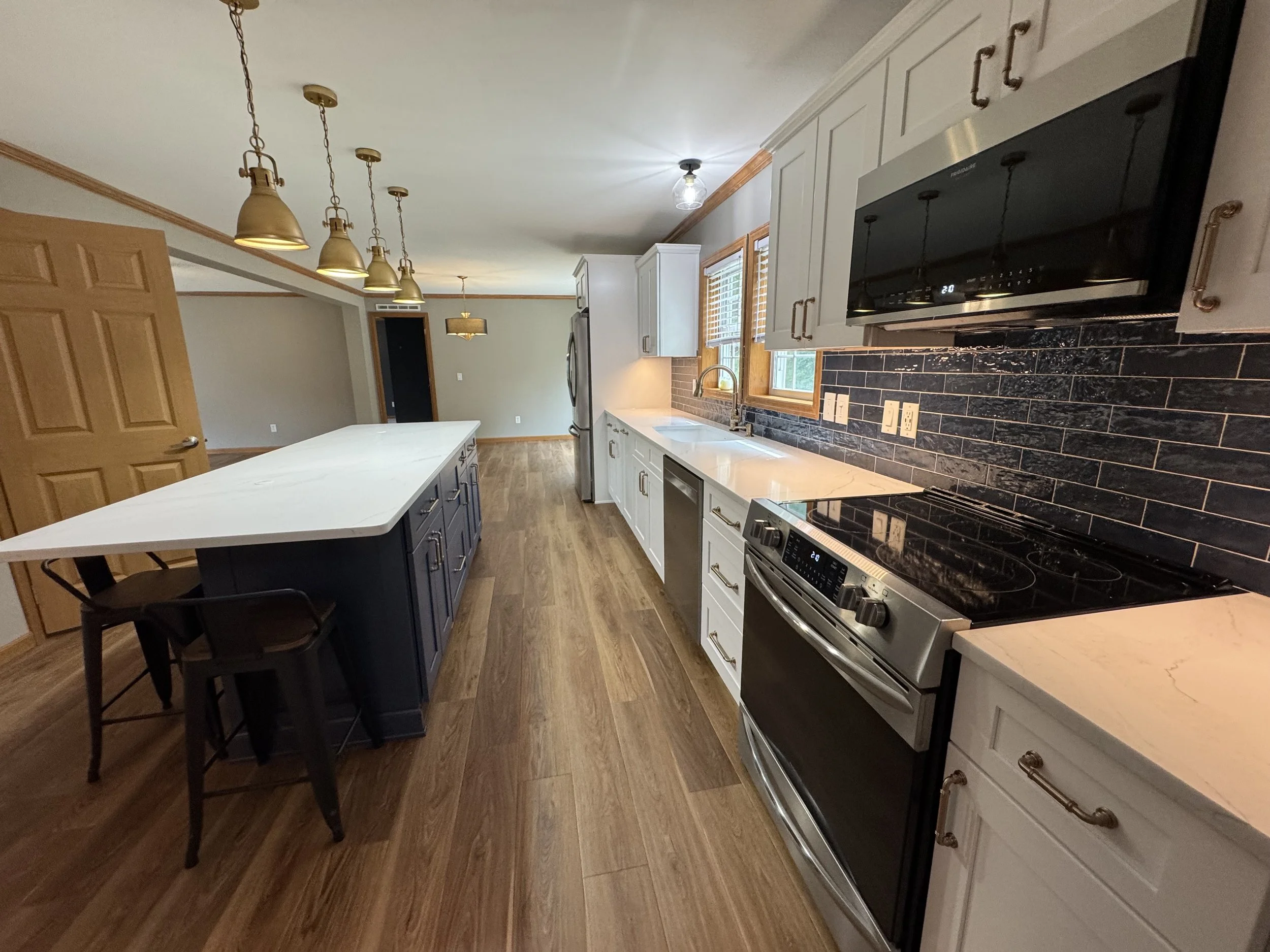 First Floor Remodel - Spring 2025 - Ocean Blue and White cabinetry, Shaw LVP flooring, MSI Quartz, Tile backsplash, Delta Touch Faucet