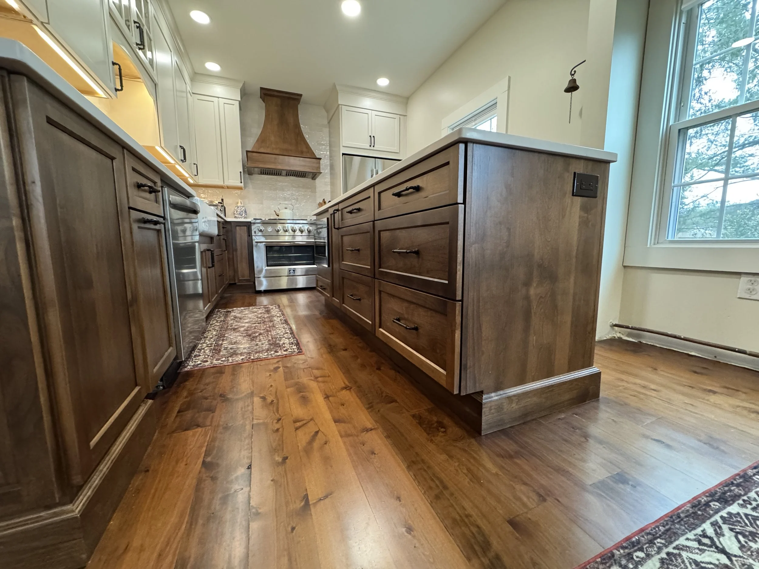 Prairie Cabinetry Alder Spice base cabinets with Maple Creamy wall cabinets - Winter 2026