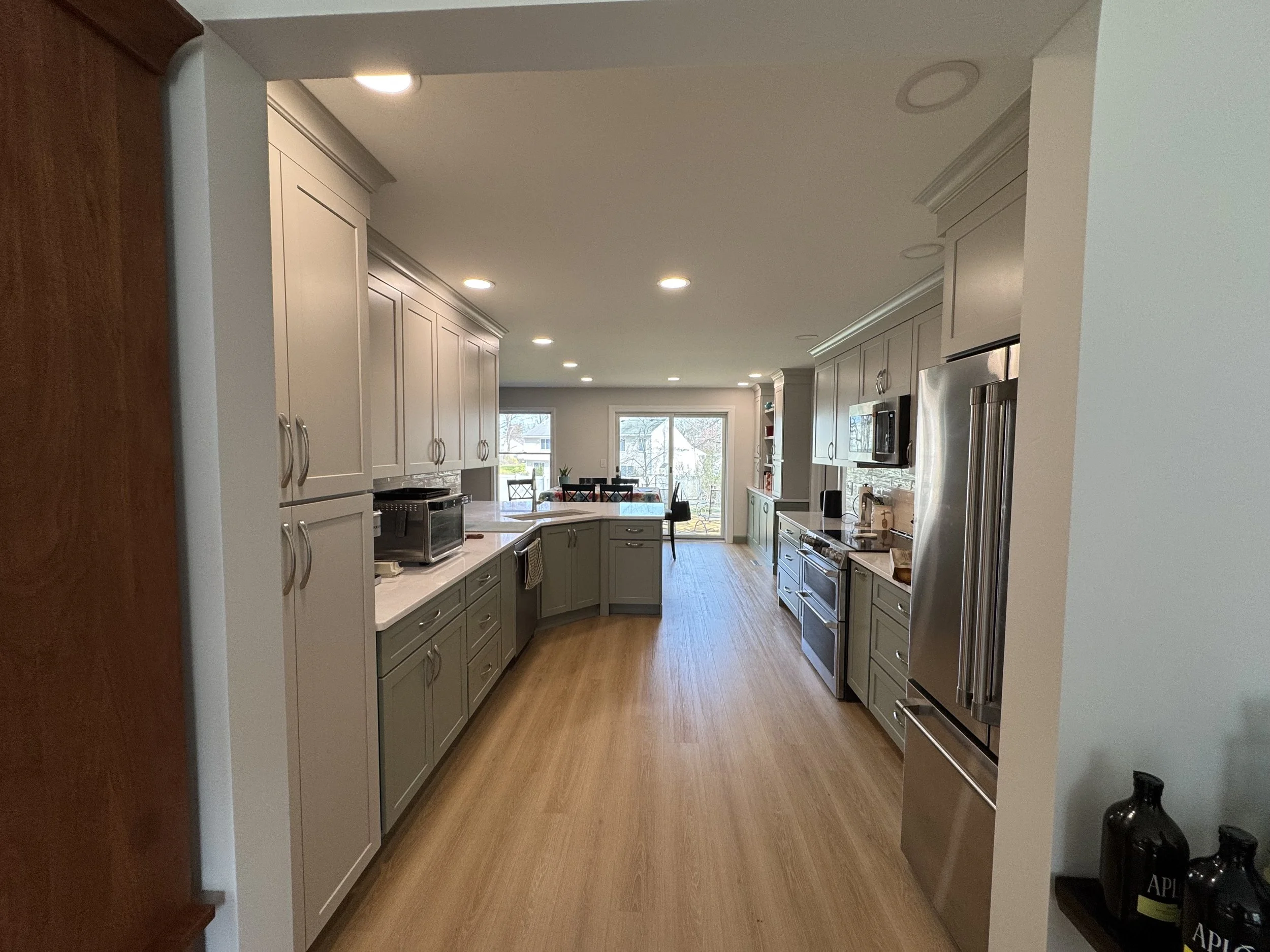 First Floor Remodel - Spring 2025 - Legend Cabinetry, Calacatta Miraggio Cove Quartz, Tile backsplash, MSI Valleyview Grove flooring