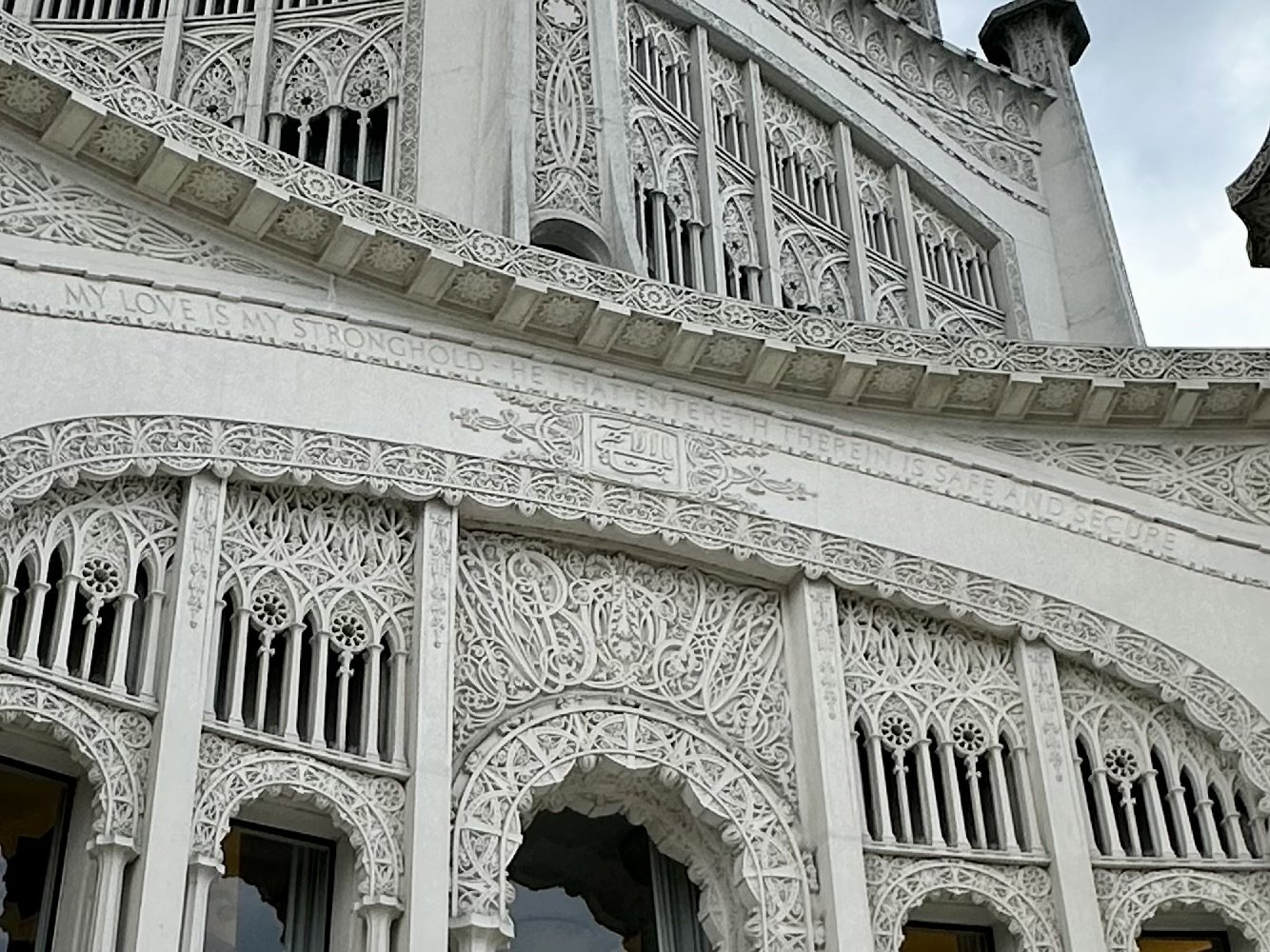 Inscription and details above one of the nine doors