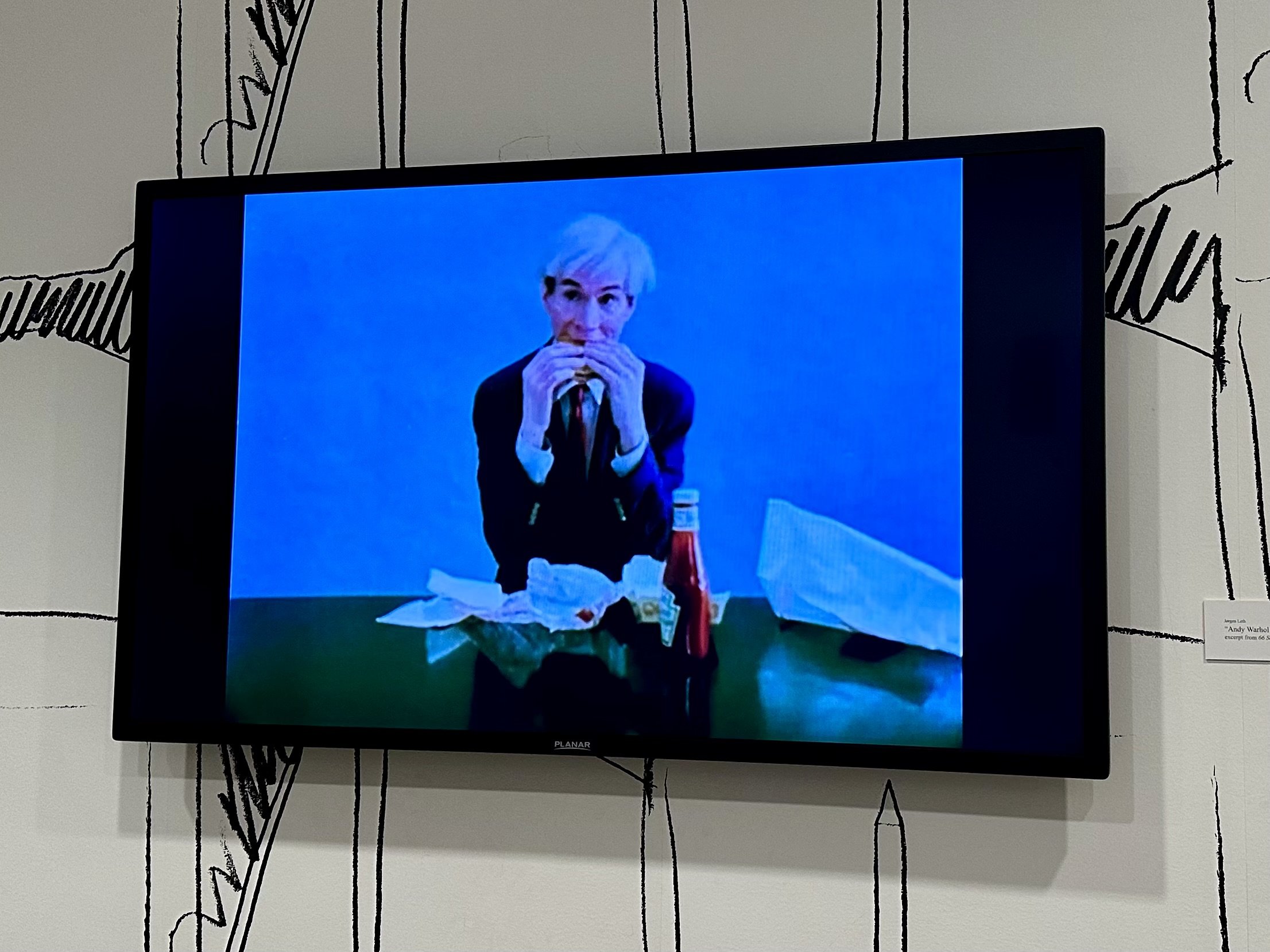 Andy Warhol Eating a Hamburger, 1982