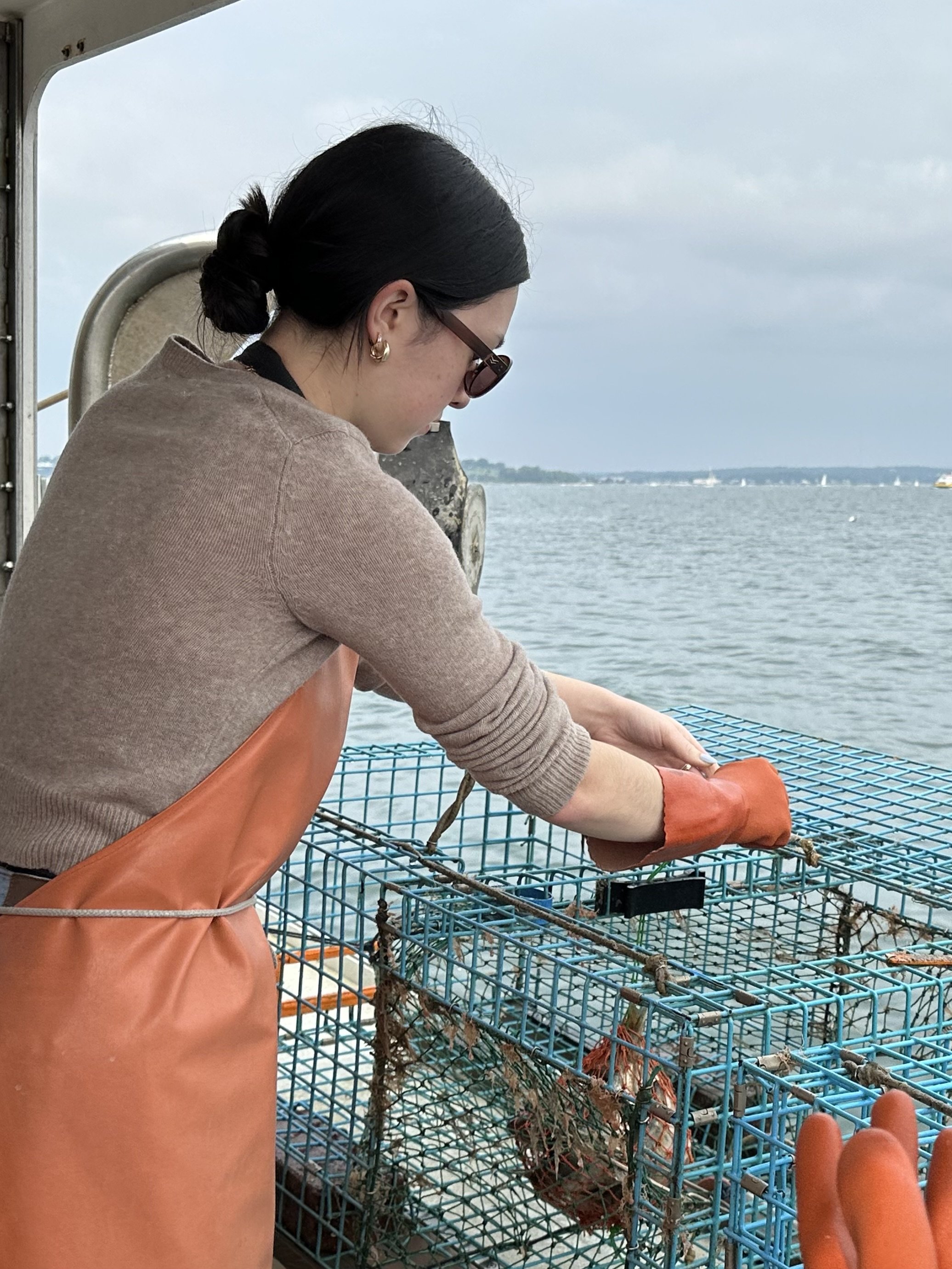 Baiting a trap before pushing it back into the water