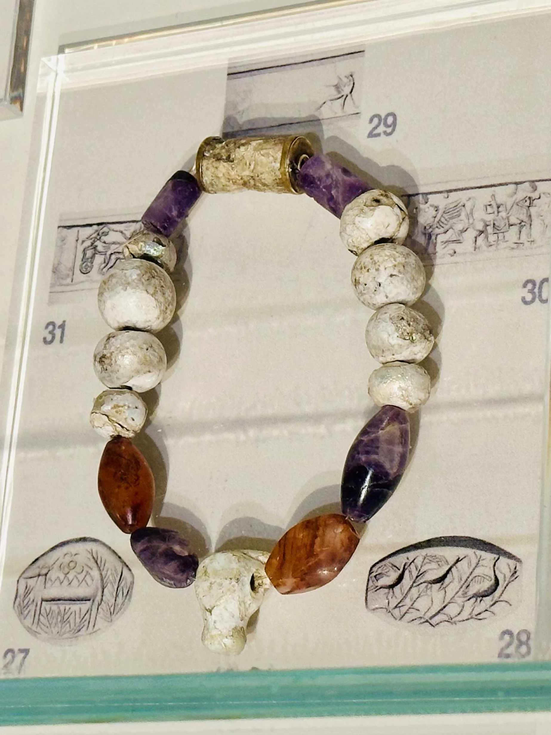 Necklace of glass, carnelian, and amethyst beads