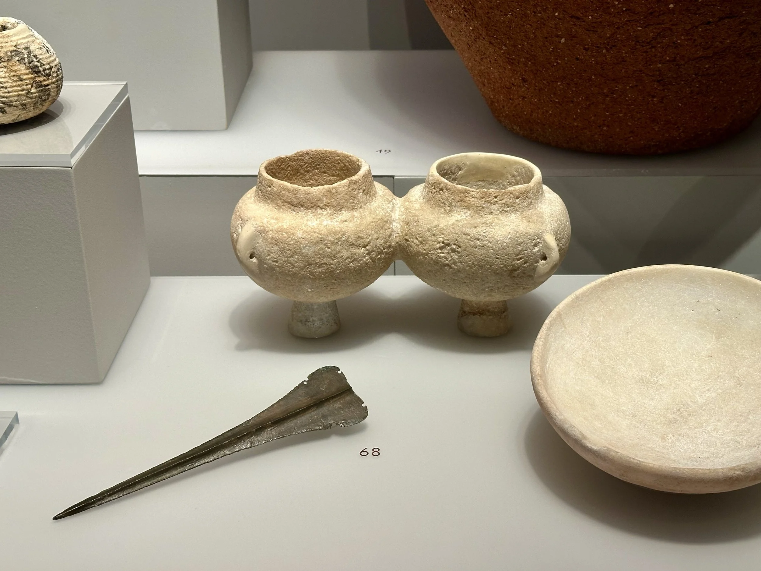 Marble Cycladic vessels and bronze dagger, 2700-2400 BCE