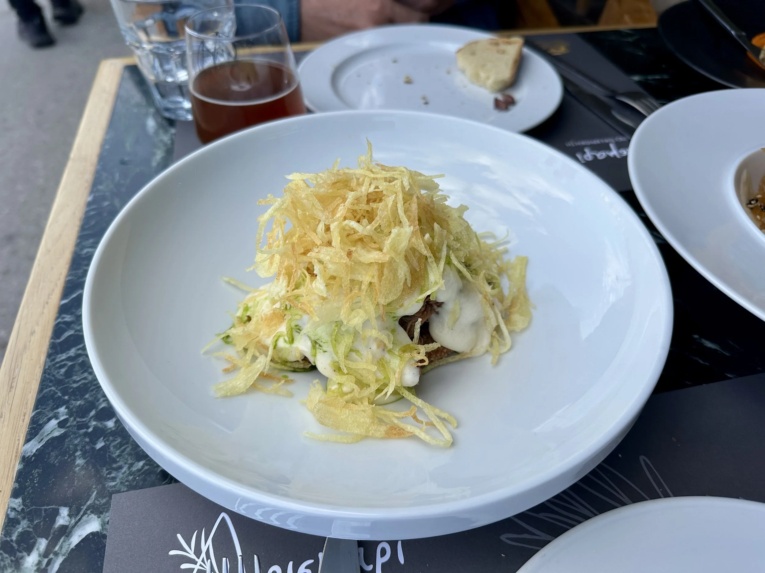 Moussaka with eggplant croquette, beef ragout, feta cheese béchamel, potato chips