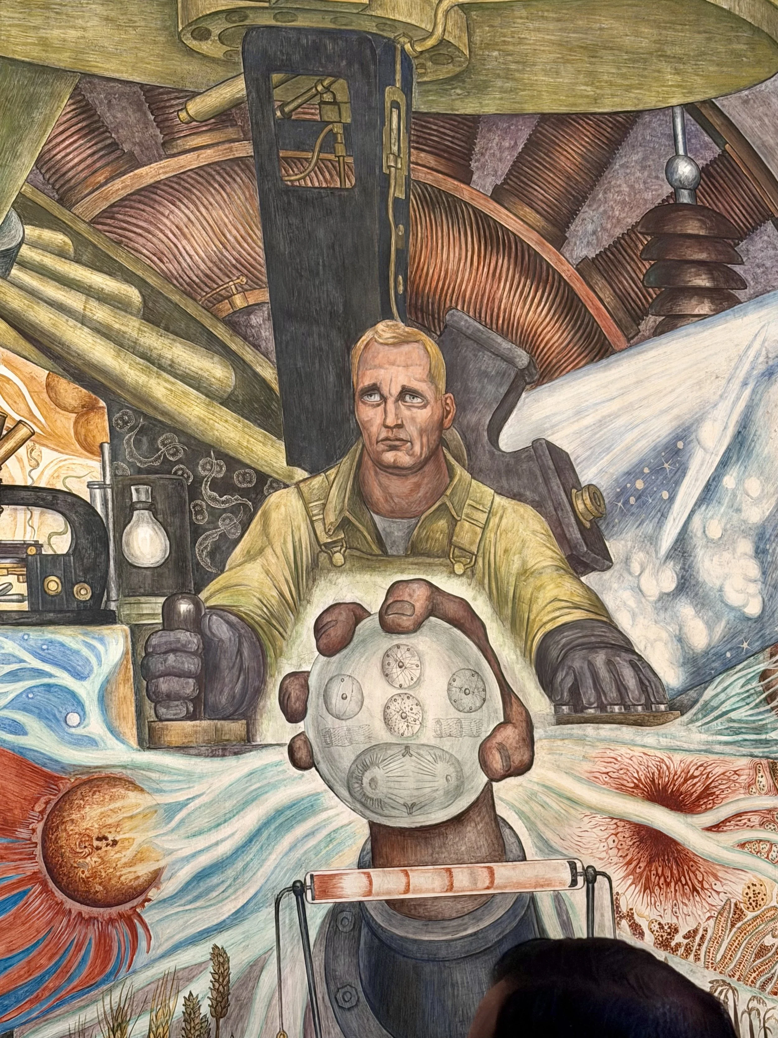  The Man at the Crossroads controls machinery behind a glowing orb of science 