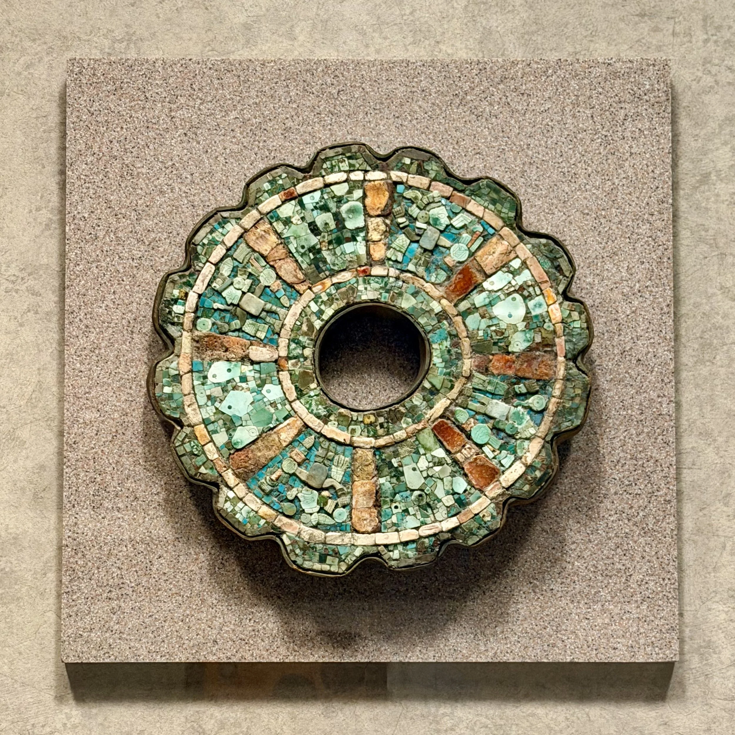 Metal ornament with turquoise inlay