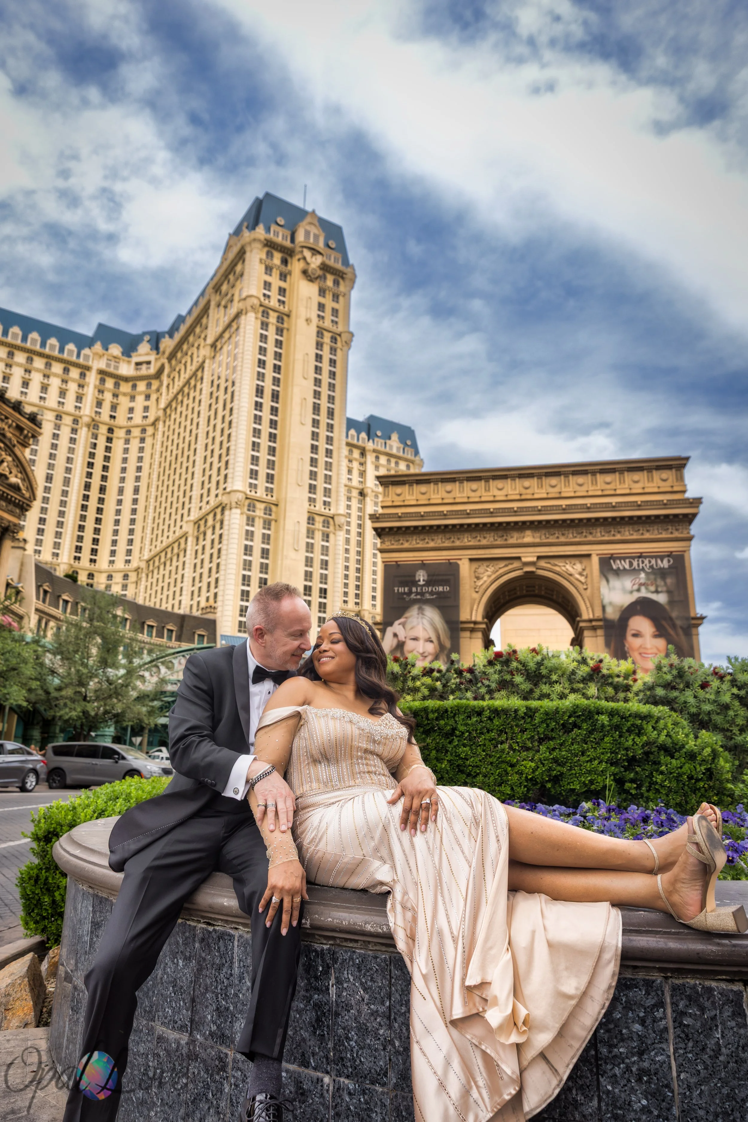 Couple embracing in front of Paris Las Vegas Eiffel Tower on the Las Vegas Strip