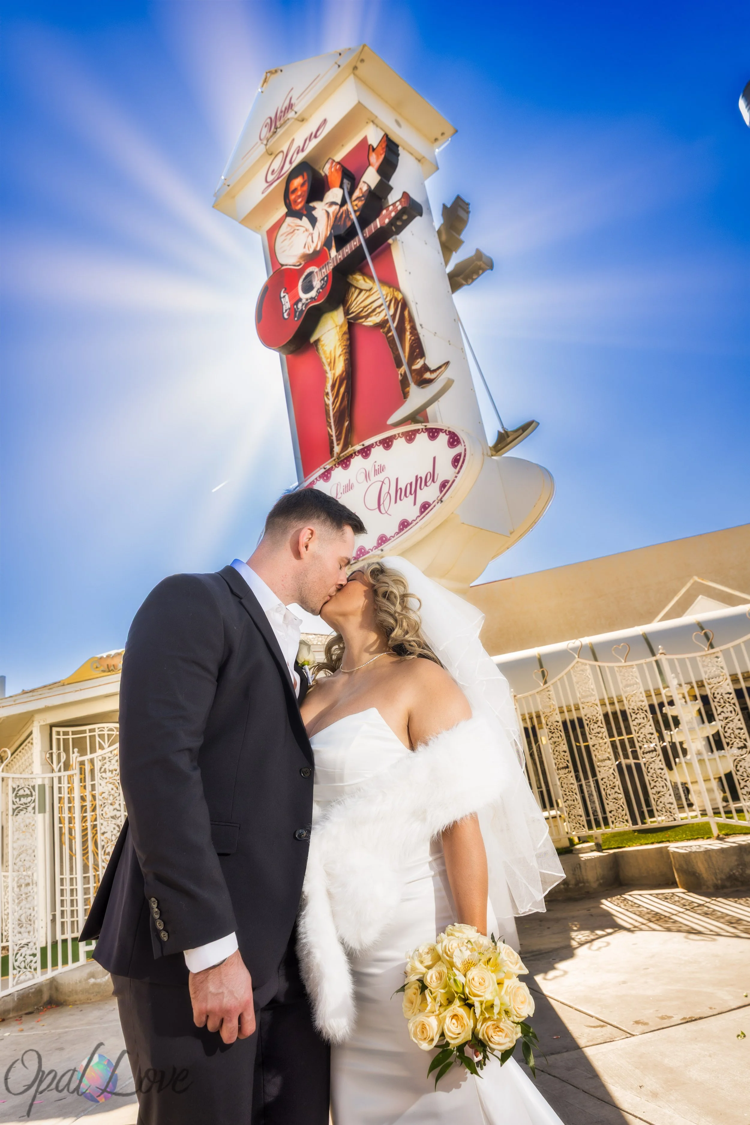 Newlywed couple outside the Little White Wedding Chapel after their Las Vegas wedding ceremony