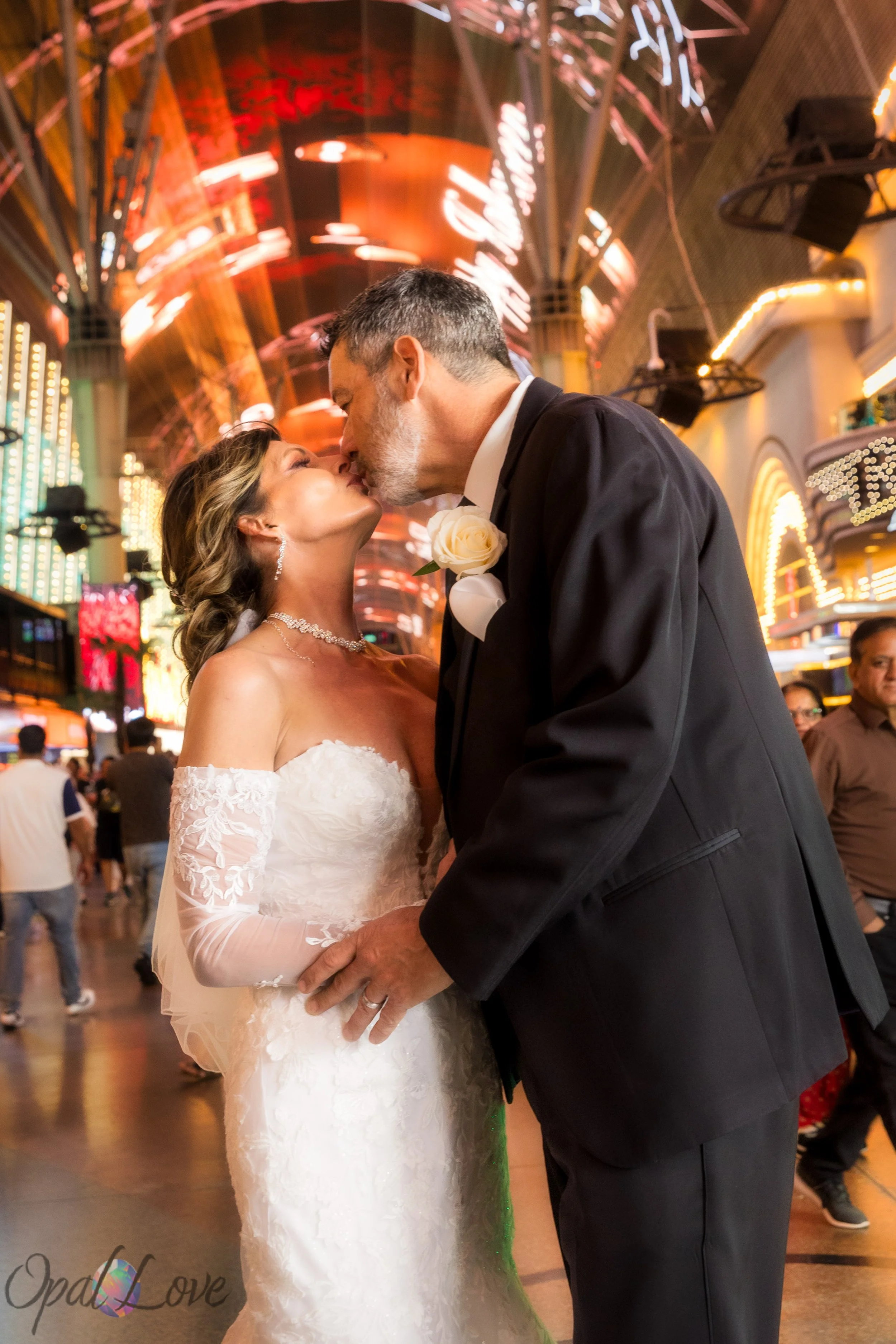 Couple kissing under the canopy on Fremont Street