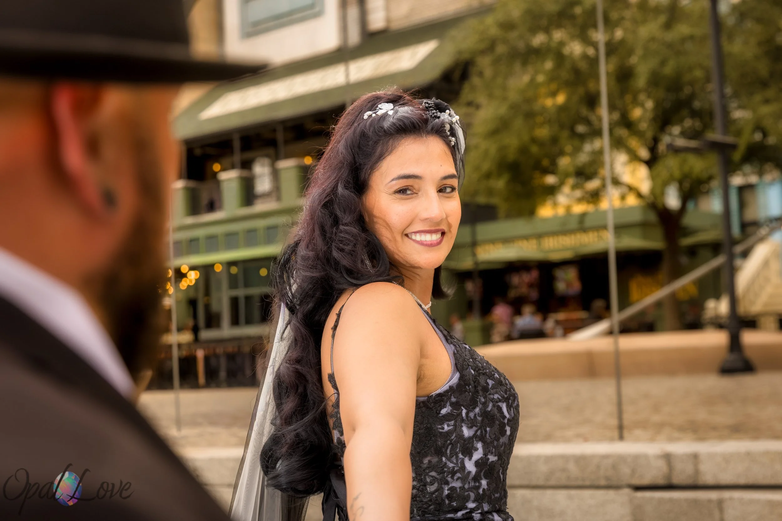 Bride smiles back at her partner during their Las Vegas wedding portraits