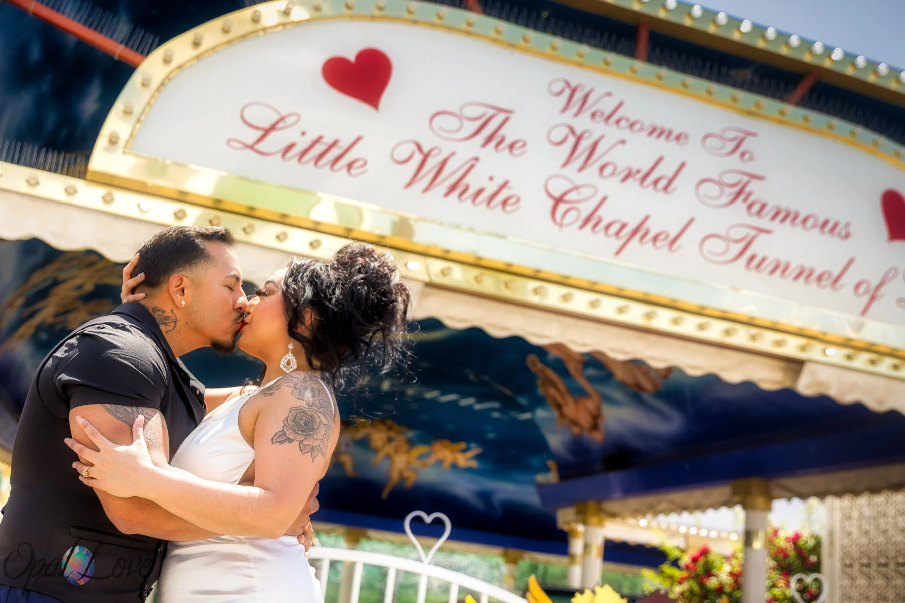 Newlyweds kiss outside A Little White Wedding Chapel in Las Vegas