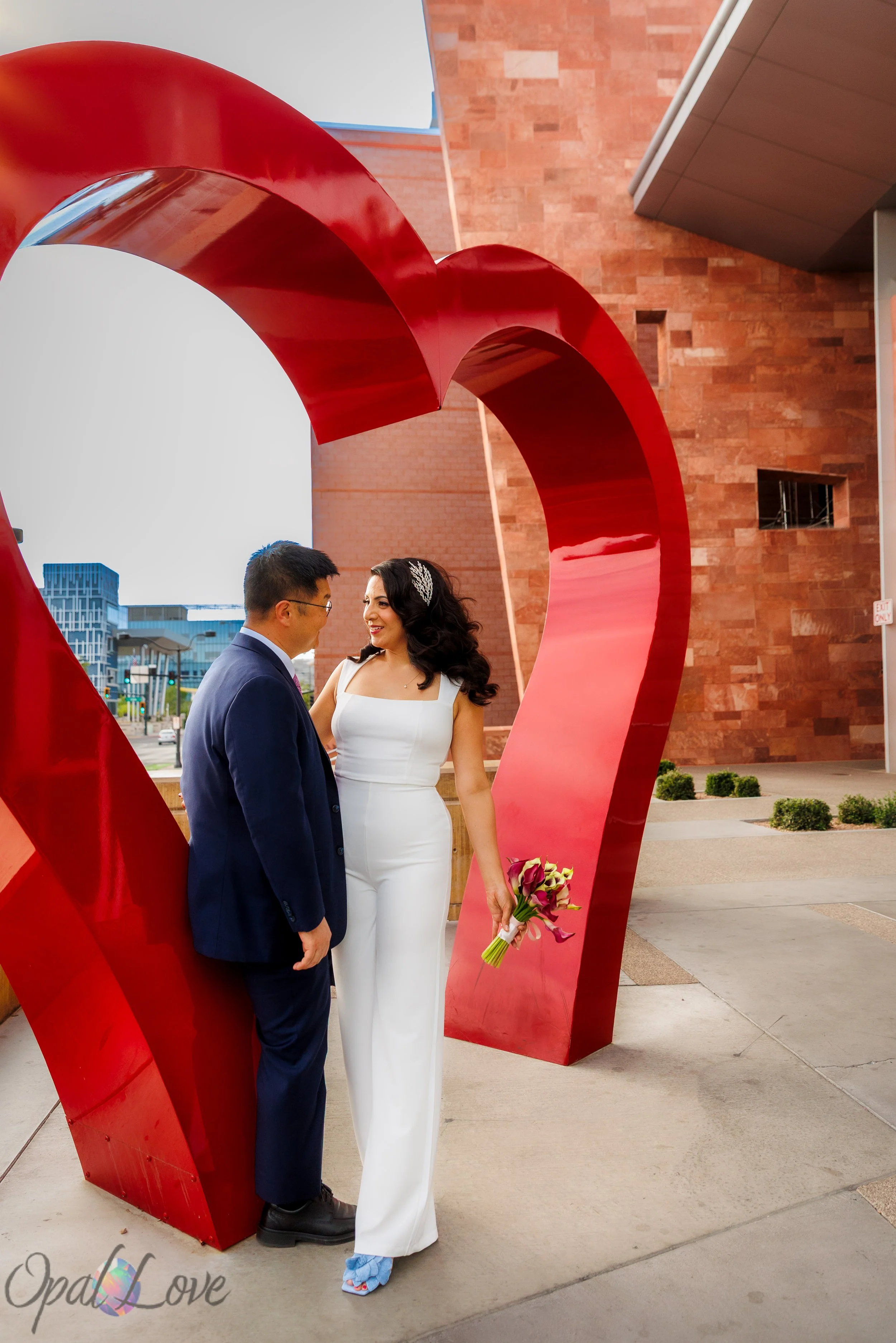 Couple standing together outside the Las Vegas courthouse after their civil ceremony captured by Opal Love Photography.