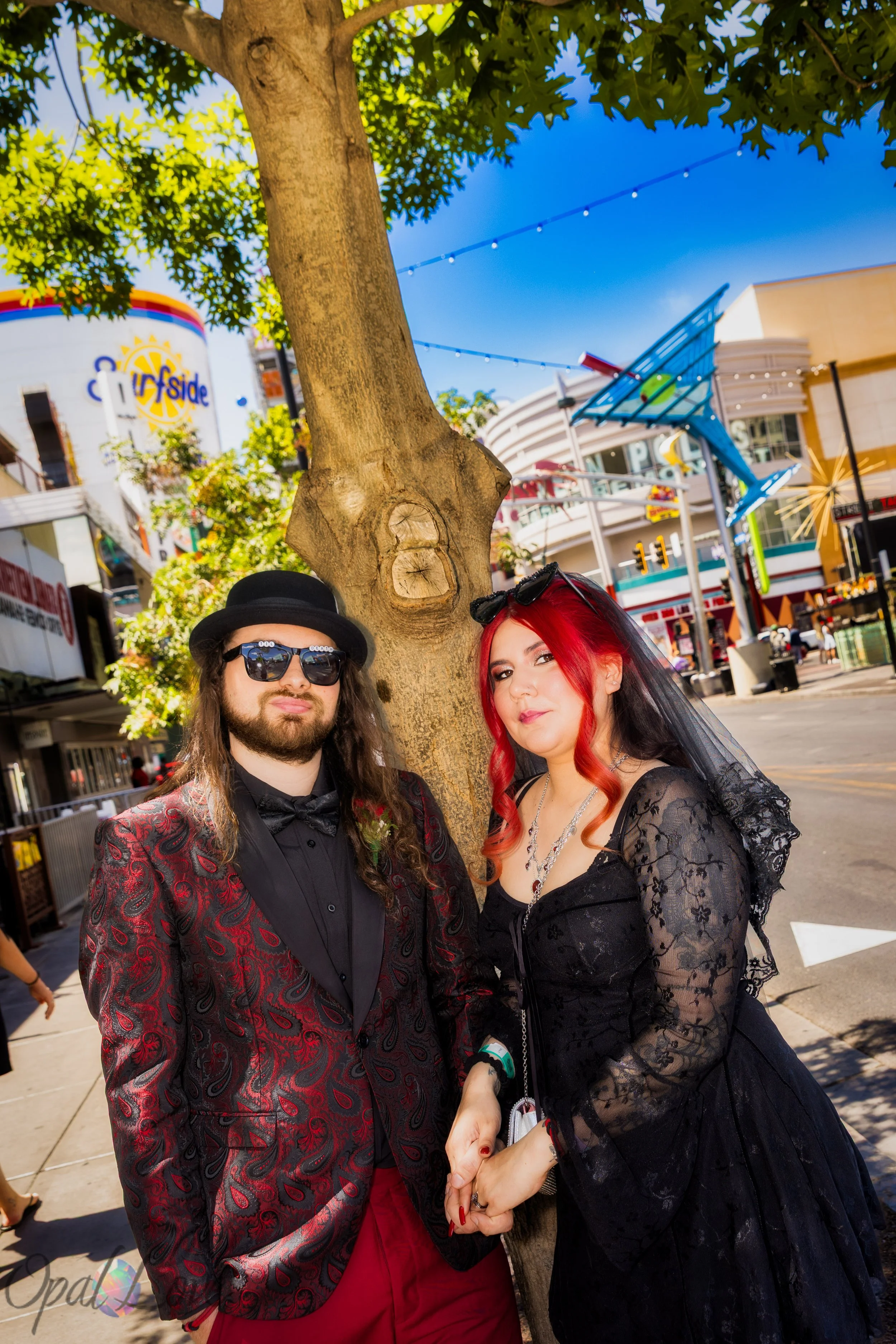 Wedding couple posing together near Fremont Street Experience in Downtown Las Vegas