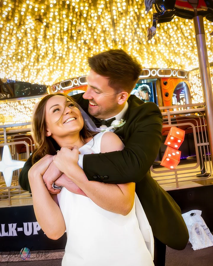 Couple laughing and embracing at the Carousel Bar on Fremont Street in downtown Las Vegas.