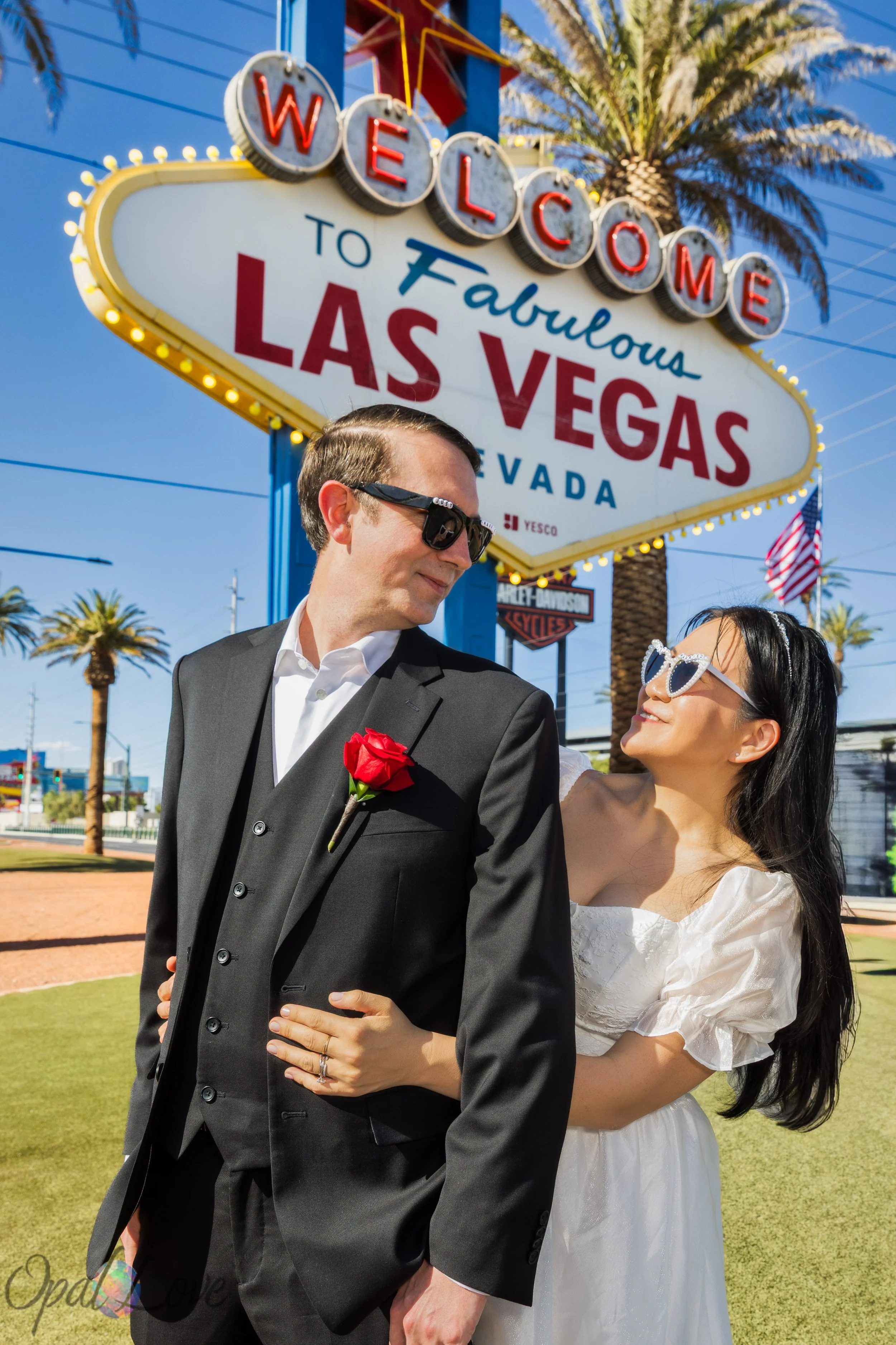 Wedding couple posing together at the Welcome to Las Vegas Sign in Las Vegas