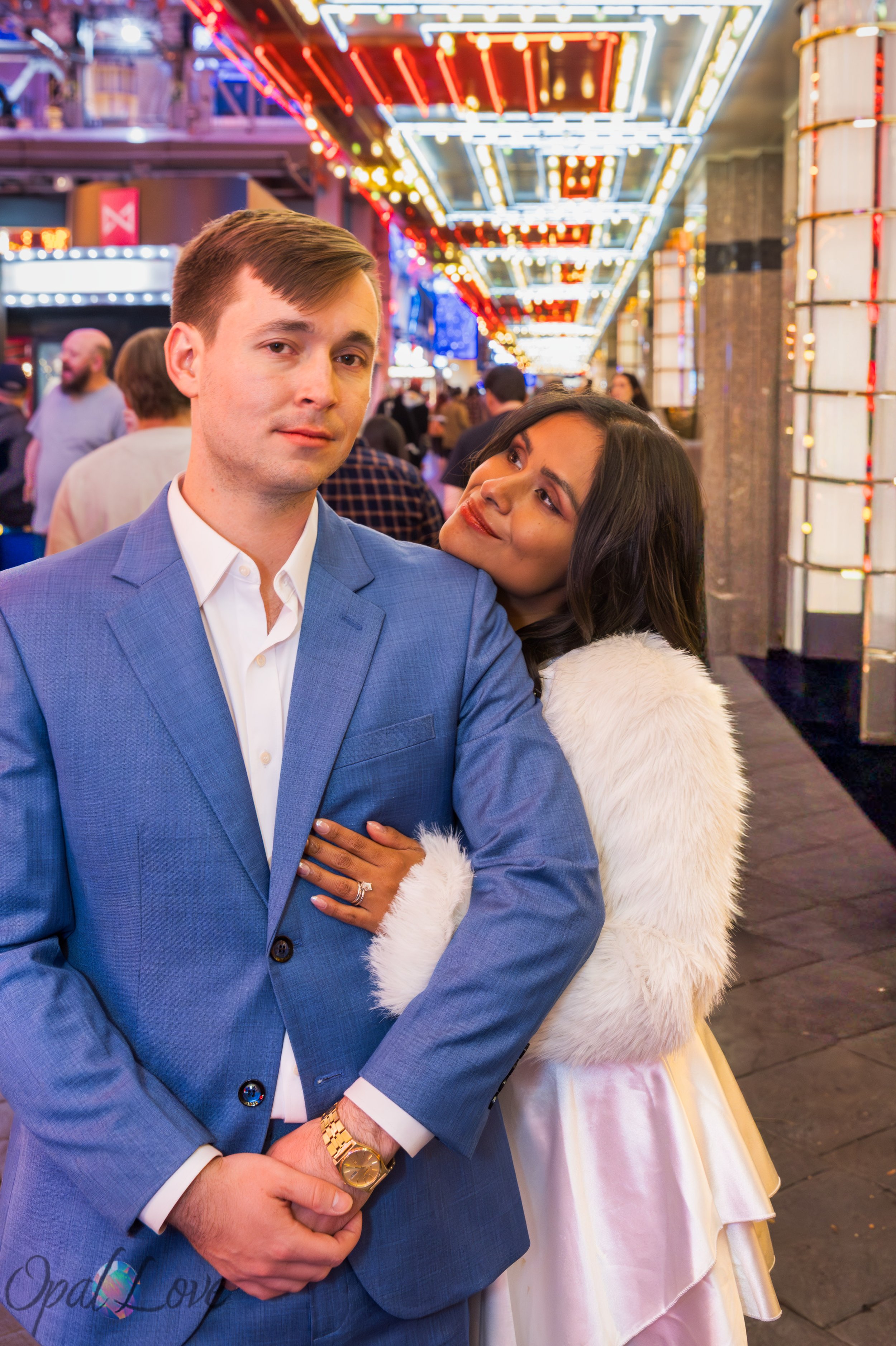 Couple embracing under colorful canopy lights on Fremont Street in Las Vegas