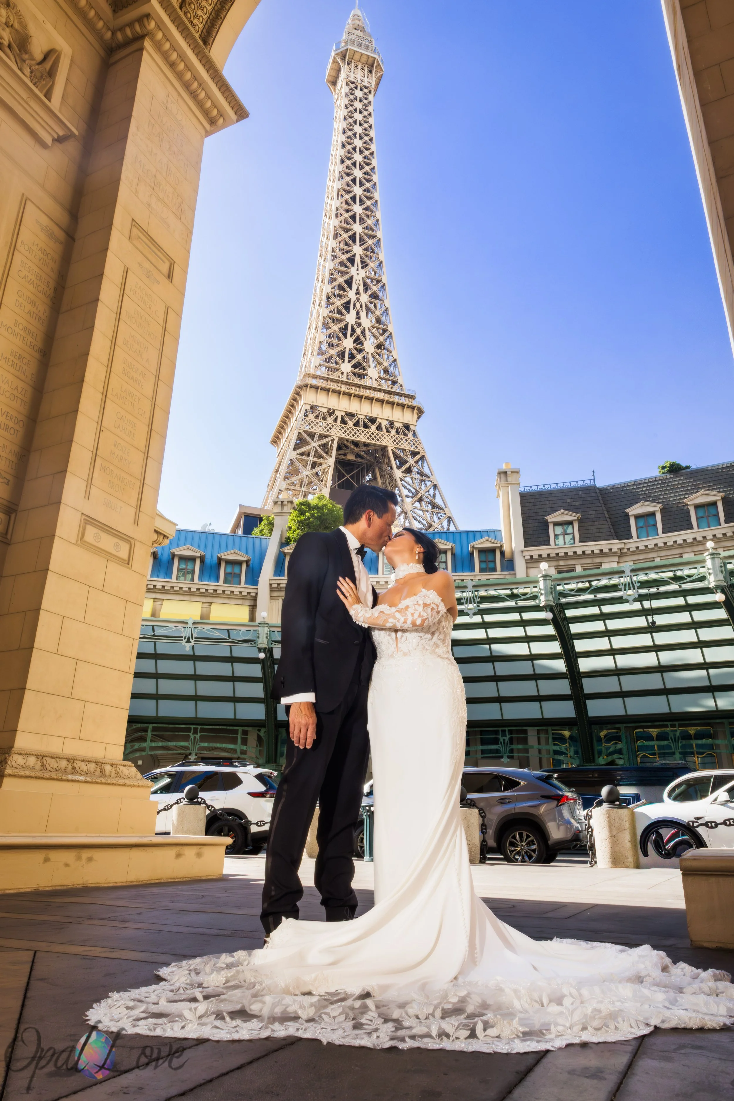 Bride and groom portrait beneath the Eiffel Tower at Paris Las Vegas