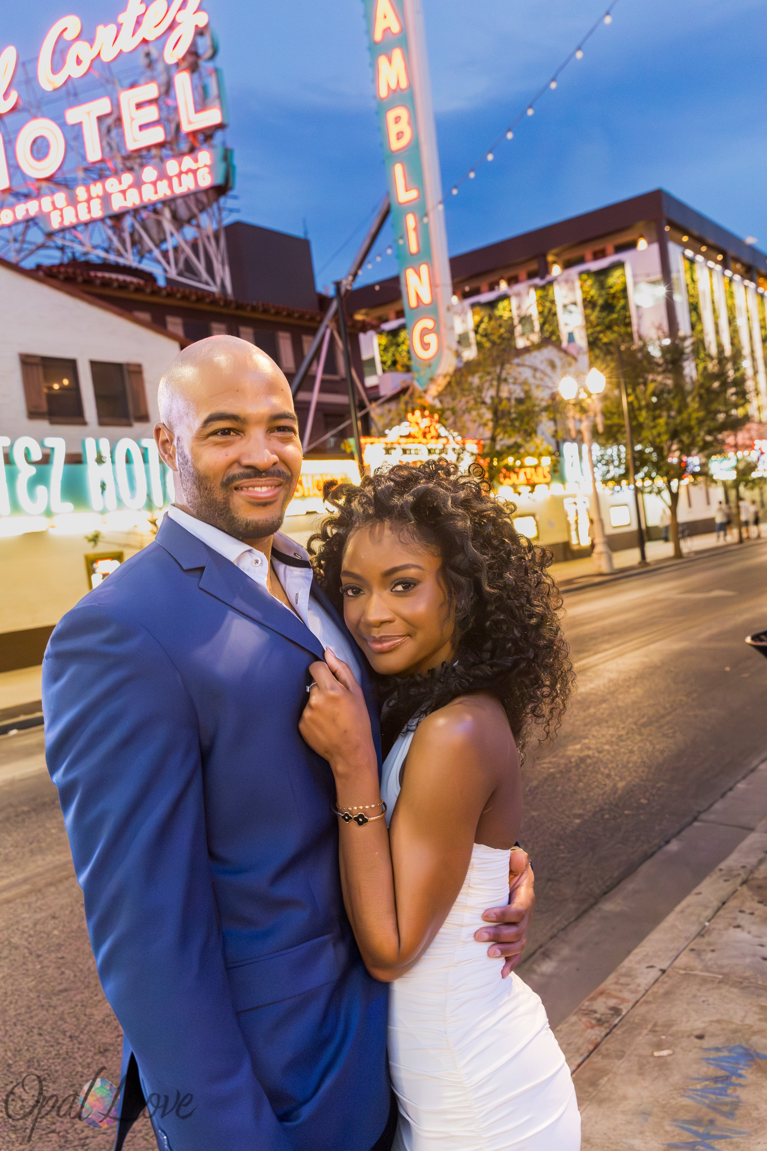 Couple standing beneath the Downtown Las Vegas