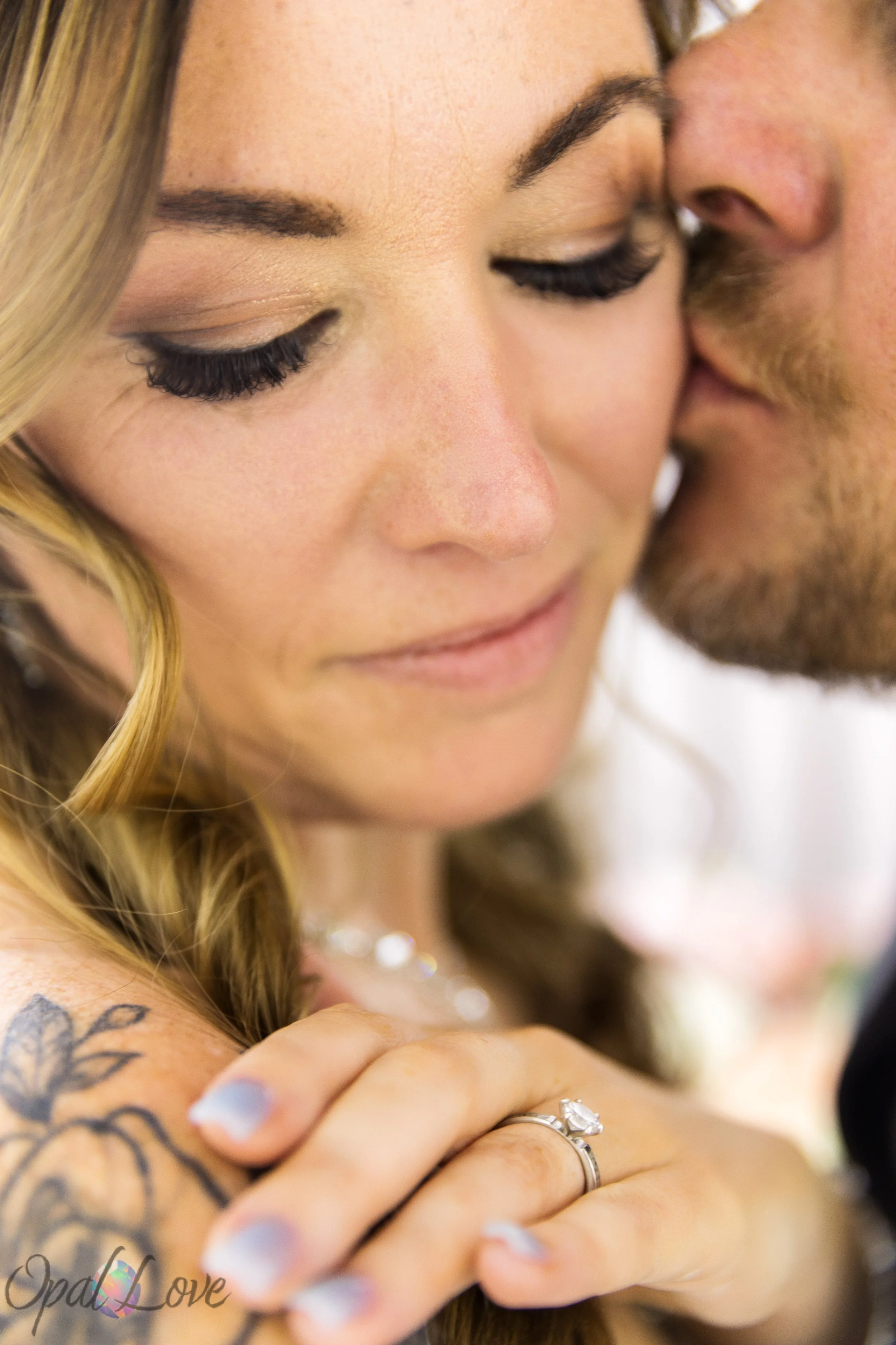 Close-up wedding portrait featuring the bride's engagement ring and intimate moment during a Las Vegas wedding day.