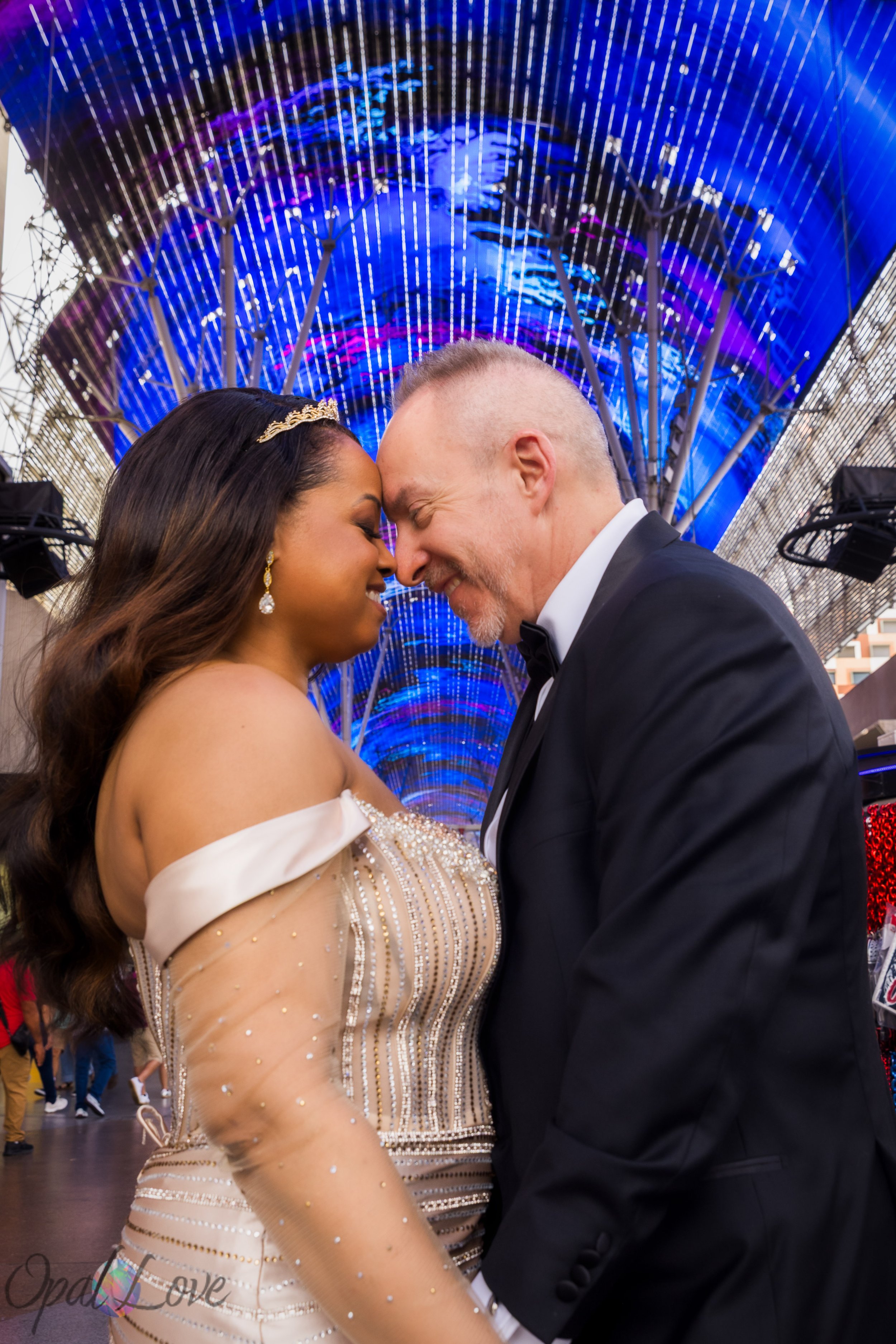 Couple standing under Fremont Street Experience canopy lights in Downtown Las Vegas