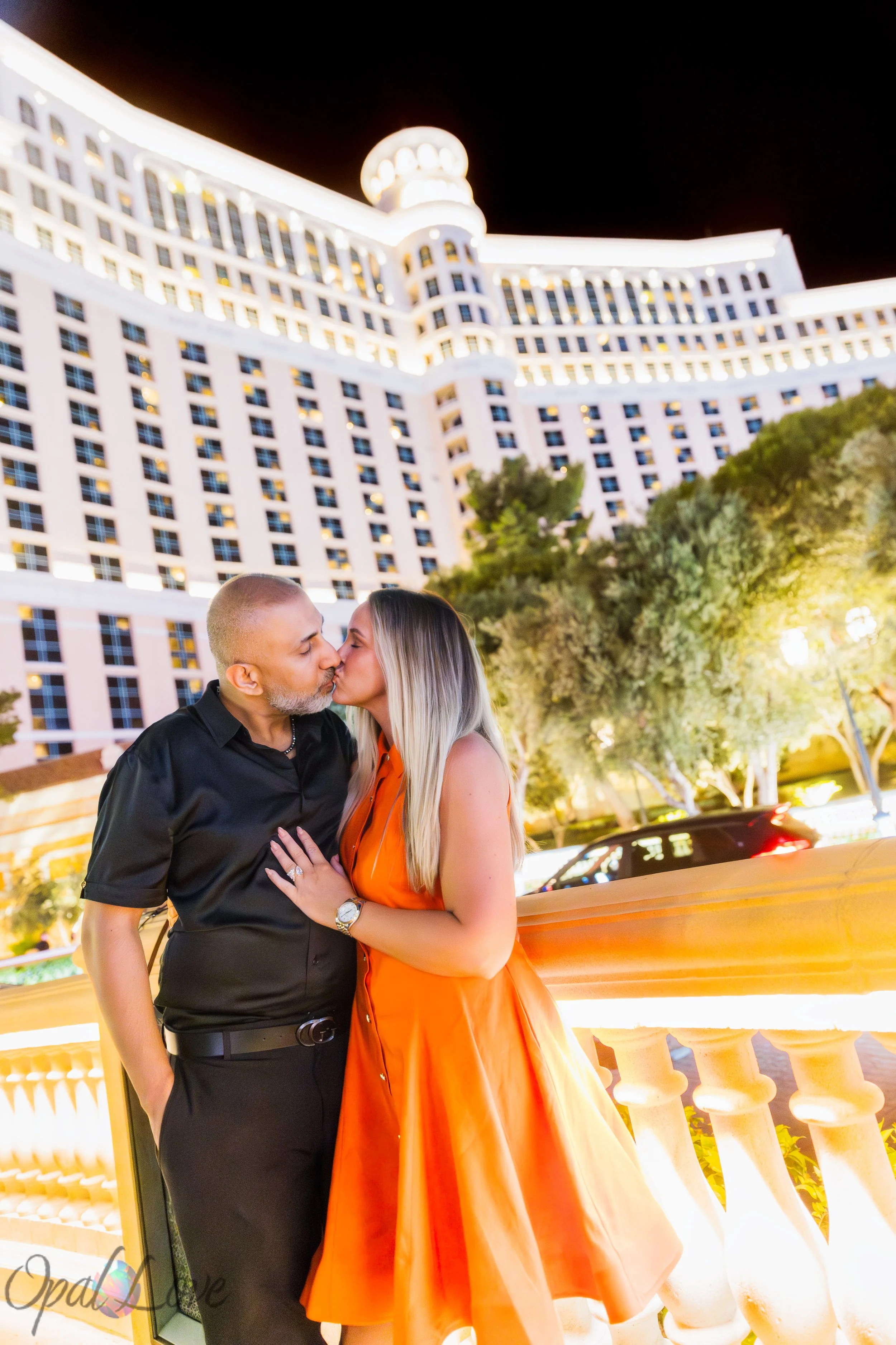 Romantic kiss portrait at Bellagio with illuminated architecture in the background