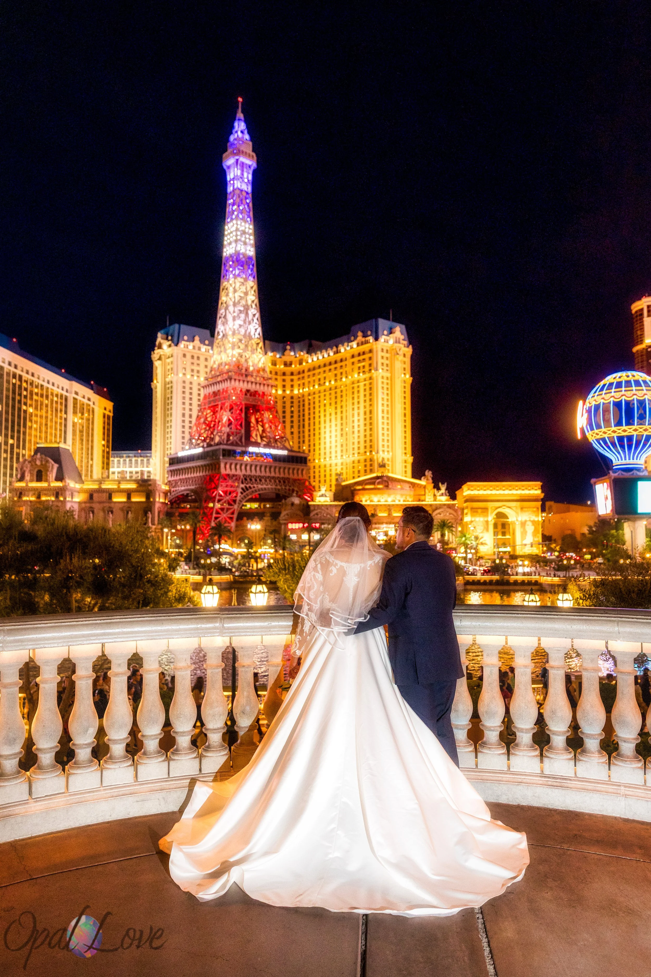 Vegas Strip wedding photography at Bellagio fountains with newlyweds