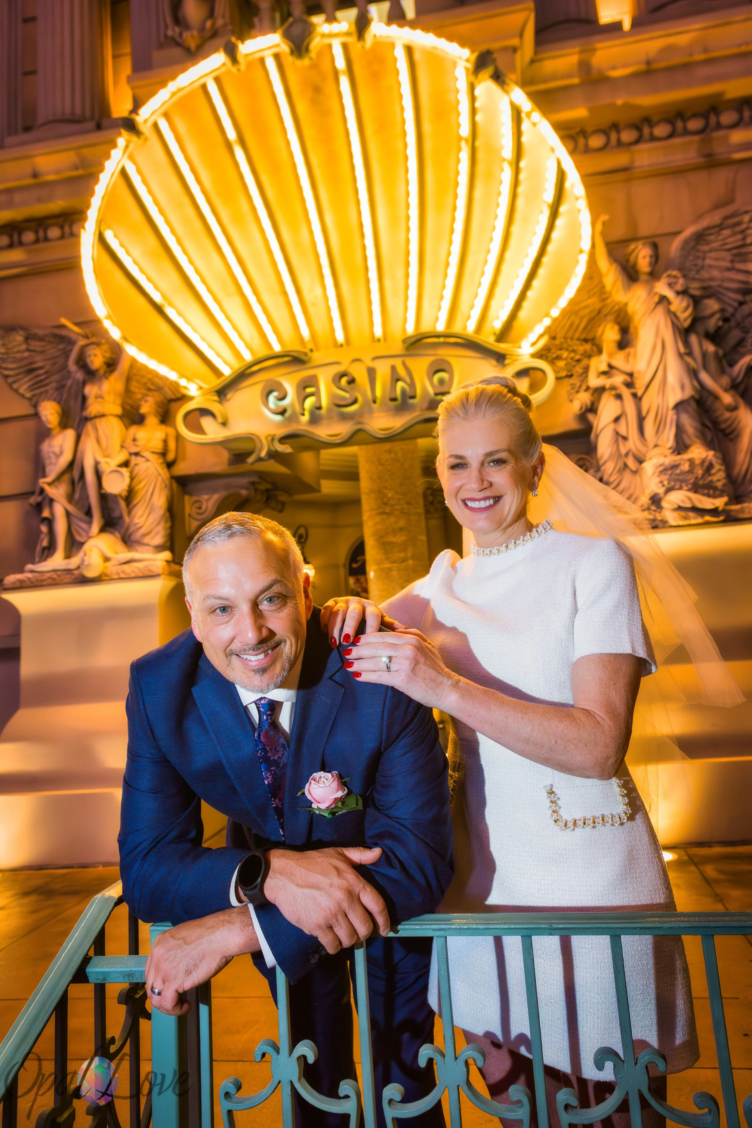 Wedding portraits at Paris Las Vegas casino entrance lights