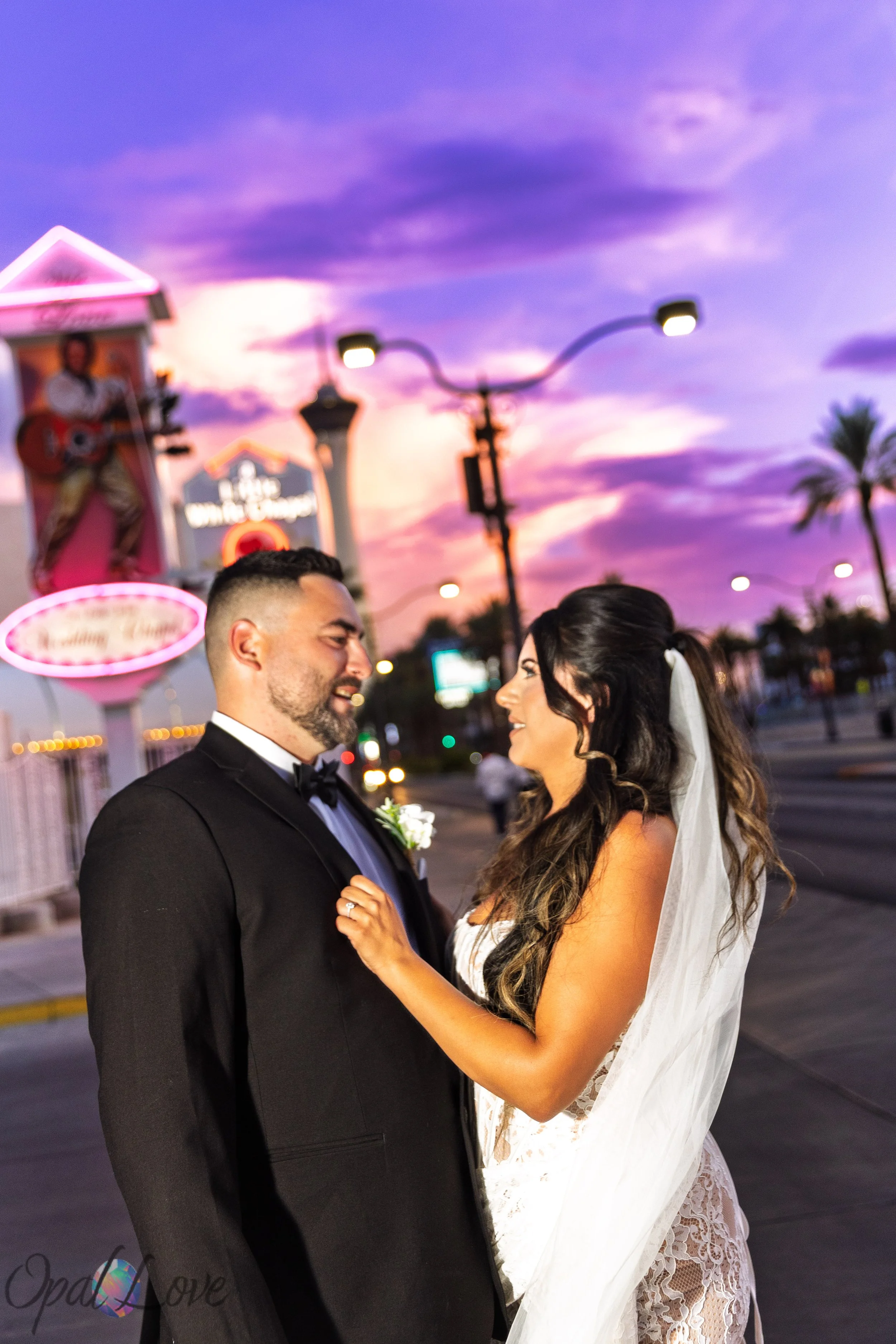 Alysha and Justin sharing a sunset portrait outside the Little White Wedding Chapel during their Las Vegas wedding.