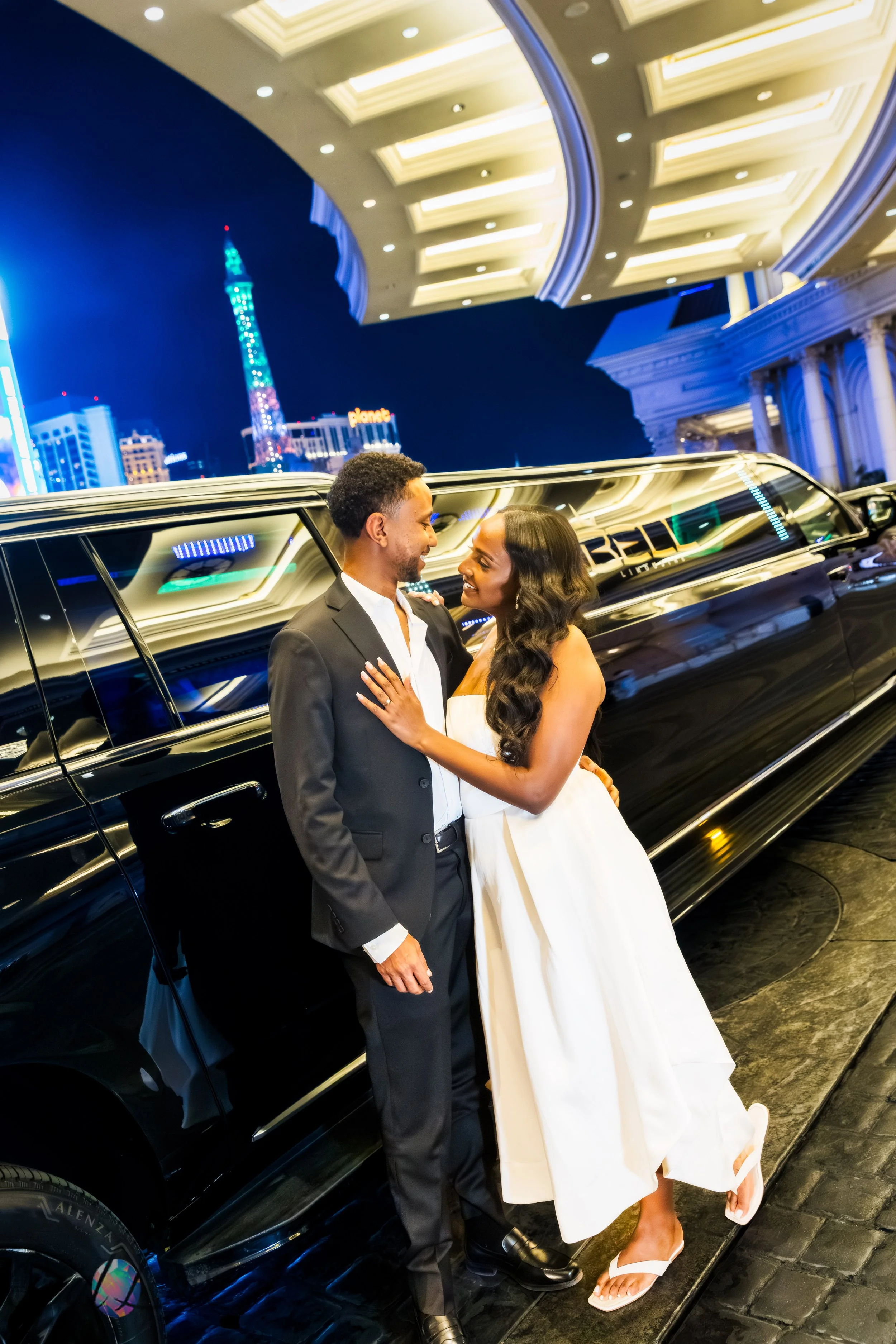 Wedding couple beside a luxury limousine during their Las Vegas wedding experience