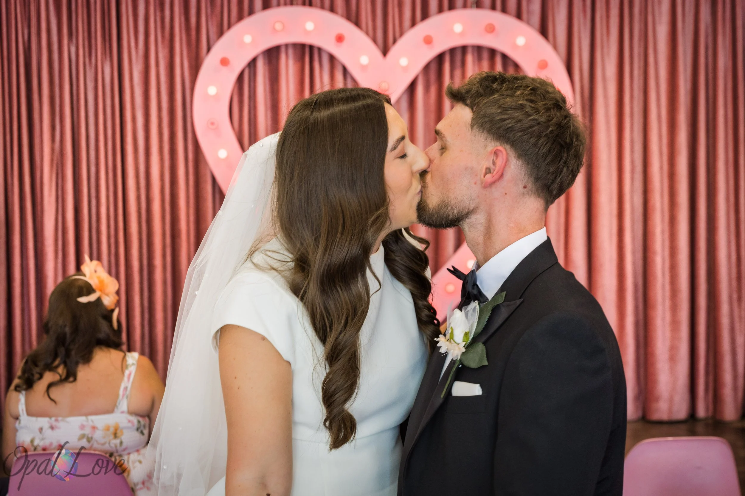 Bride and groom sharing a kiss inside A Sure Thing Wedding Chapel in Downtown Las Vegas