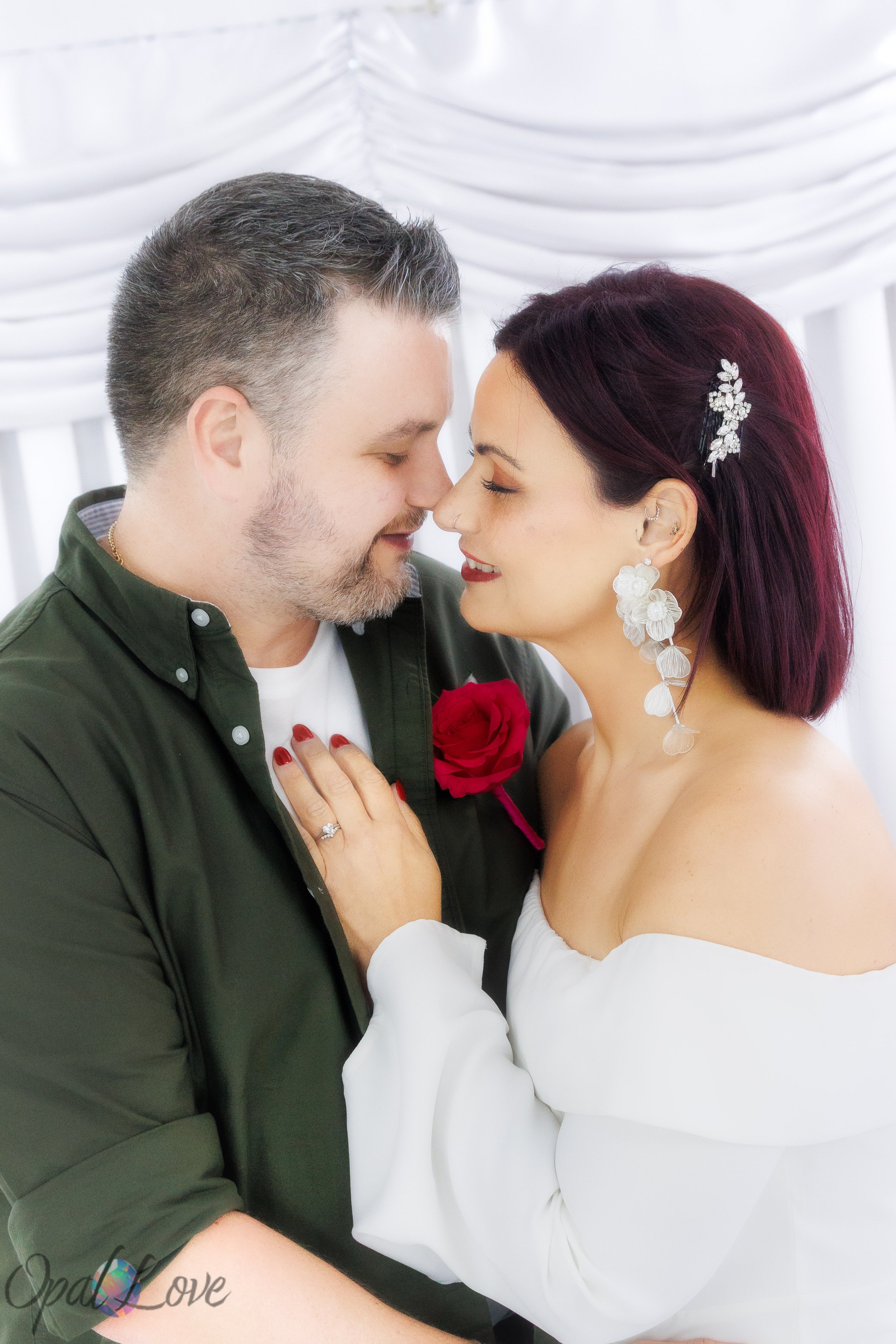 Close up portrait of bride and groom embracing inside the Little White Wedding Chapel in Las Vegas.