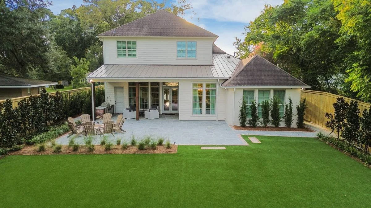 Aerial view of a backyard bluestone terrace, fire pit and synthetic lawn — Flora Landscape Contractors