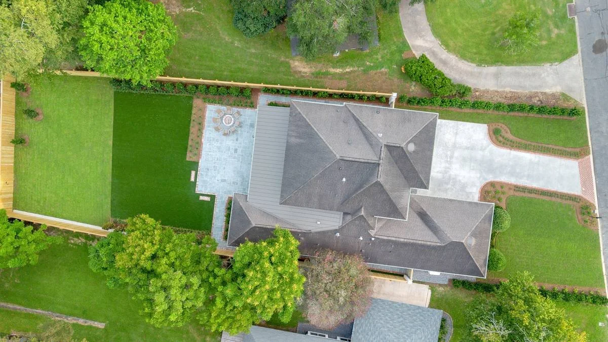 Overhead aerial view of the full property, front drive to rear lawn — Flora Landscape Contractors
