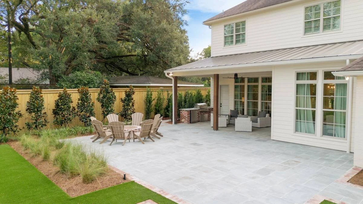 Ornamental grasses in a bed beside the bluestone terrace and lawn — Flora Landscape Contractors