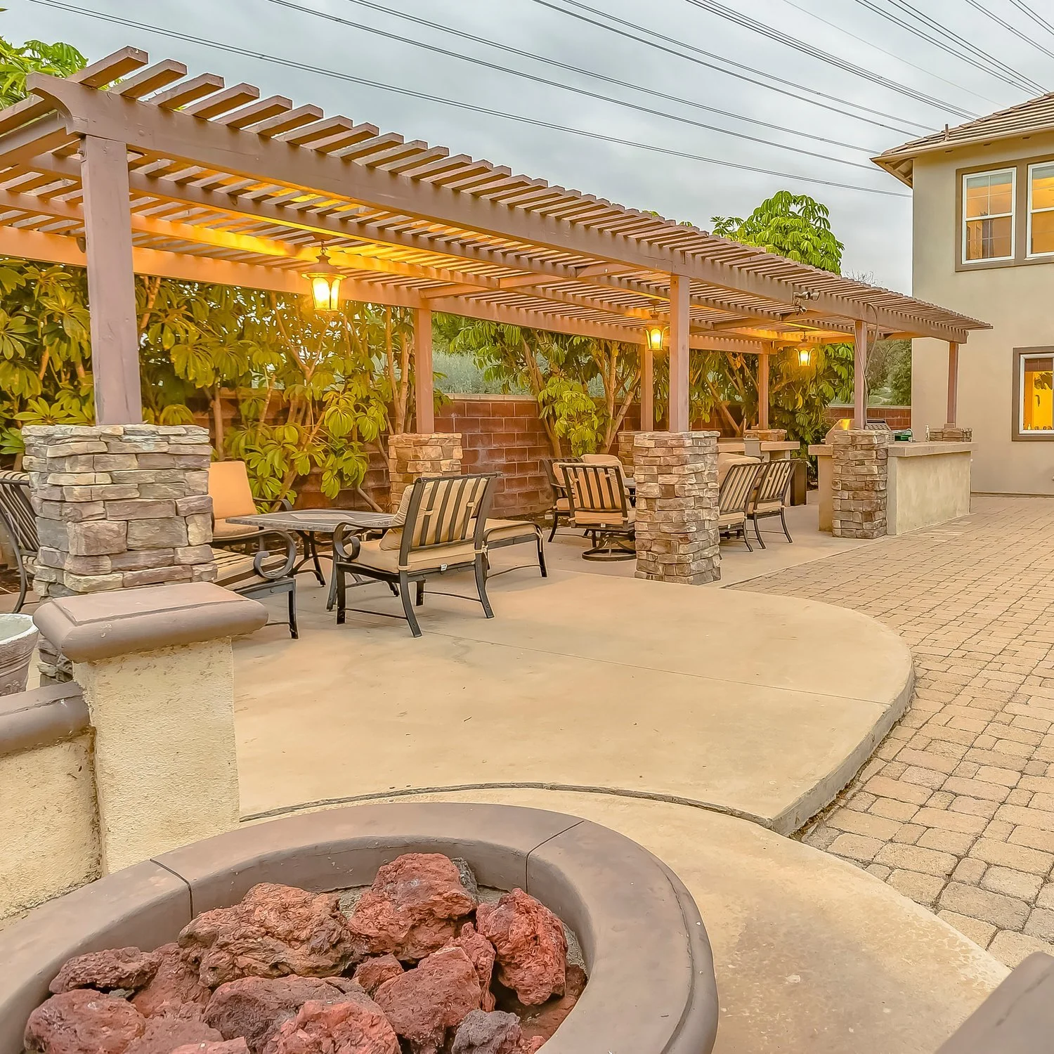 pergola and paver patio by Flora Landscape