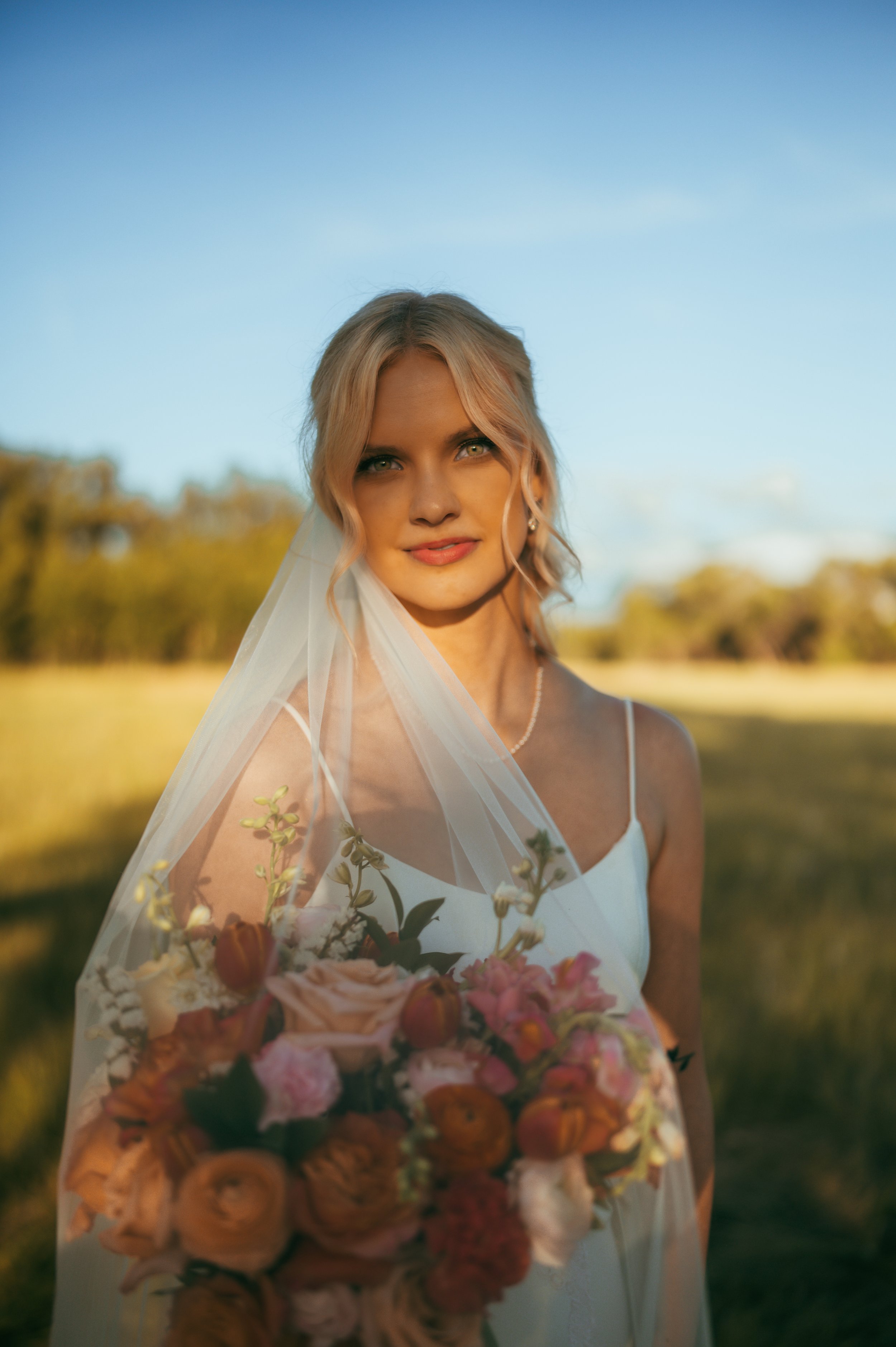 Elegant bride in her wedding gown at The Chateau Event Center in Bozeman, Montana, photographed by Autumn Faith Photography, Montana wedding photographer.