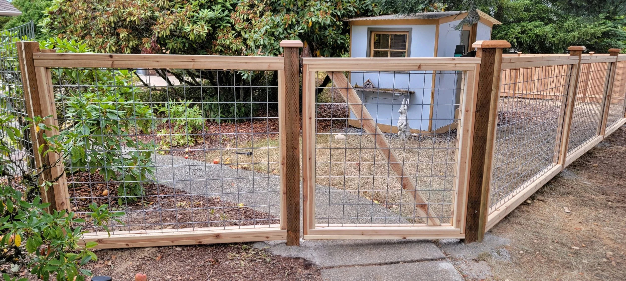 Wood and wire pathway fencing for private residence