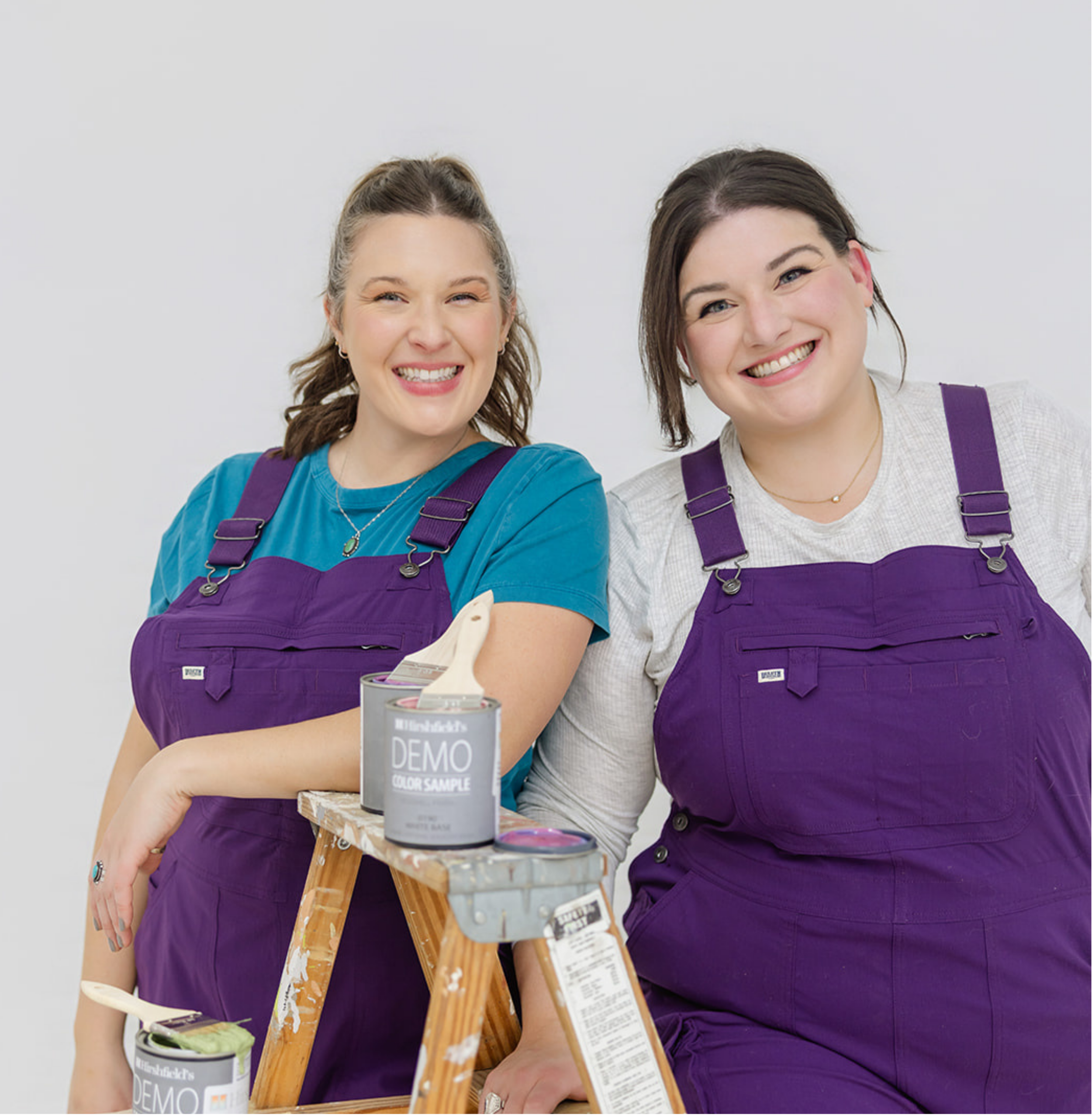 Professional and friendly portrait of the founders of The List, a Minneapolis painting and creative installation company, in their signature purple overalls. Part of the comprehensive brand identity designed by Allie Marie Design.