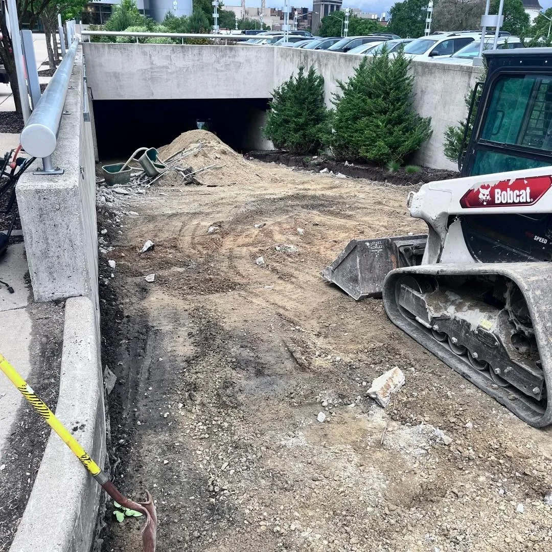 Michael, Casey, and Gavin teamed up to remove this 180x25 ft car ramp on University Ave. A day and a half removal with rebar throughout the concrete, all between two retaining walls.

#tcrservices #quadaxle #dump #HaulingServices #haul #demolition #T