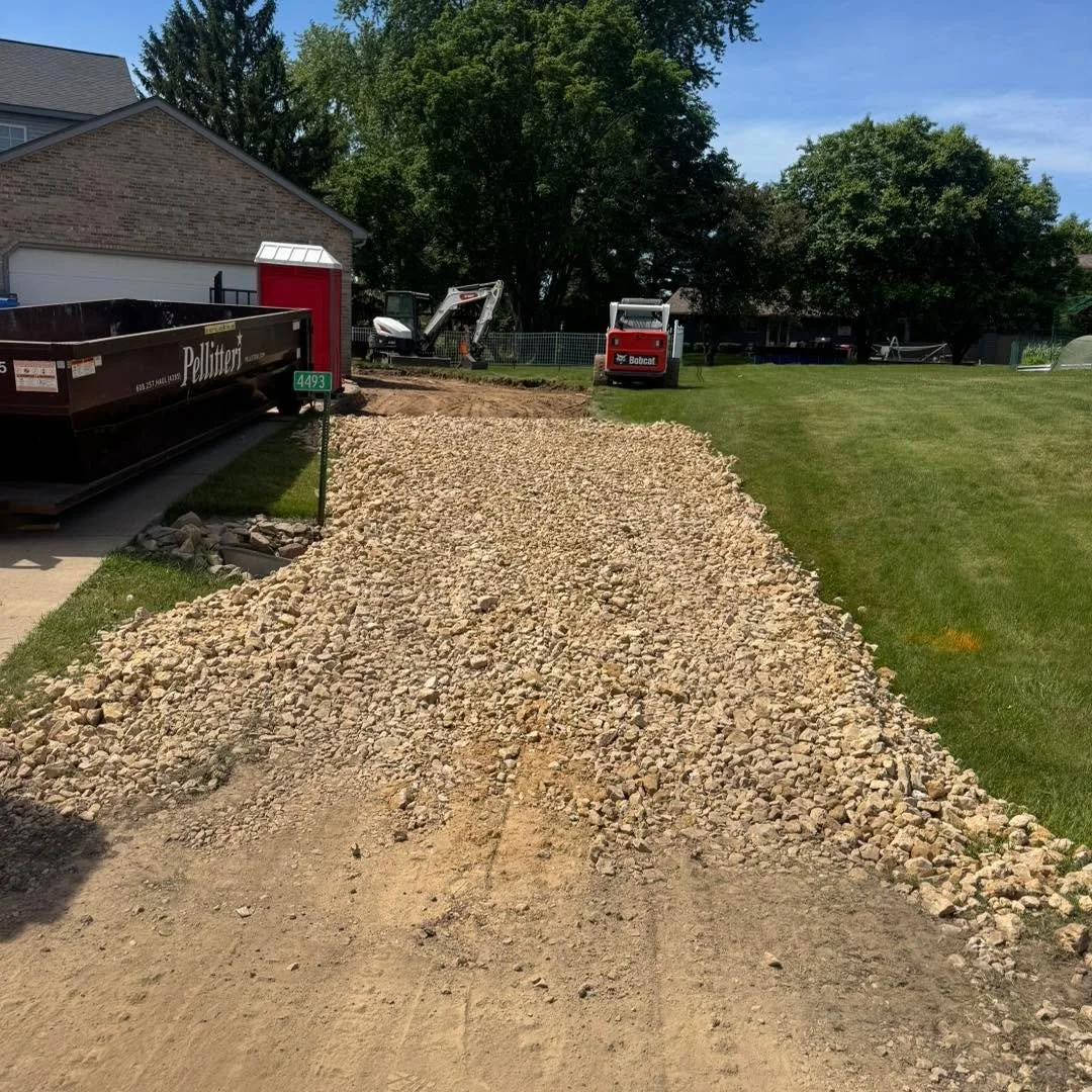 Gavin spent the afternoon in Deforest getting a site ready for a new garage addition. He excavated a 5' wide x 4' deep x 50' long trench for the new frost walls. 
We'll be back soon to backfill and cut down the existing garage wall to tie everything 