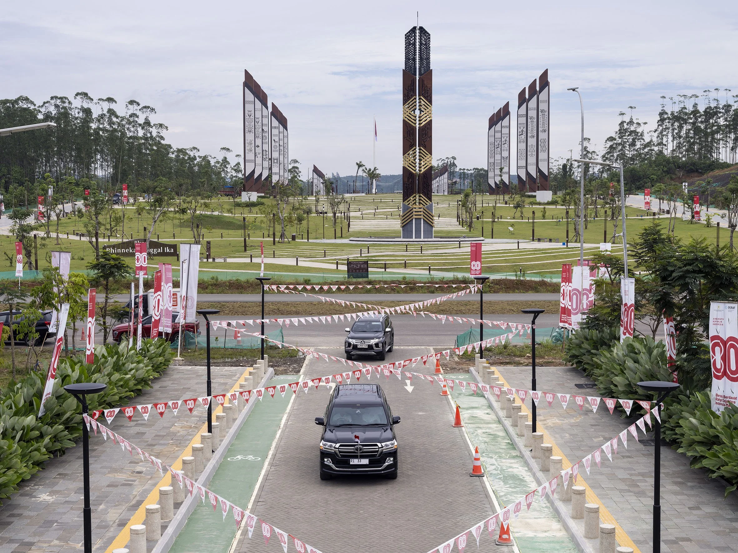 Government cars drive up to building of the Nusantara Capital City Authority, looking out over Plaza Bhinneka Tunggal Ika. 25 August 2025