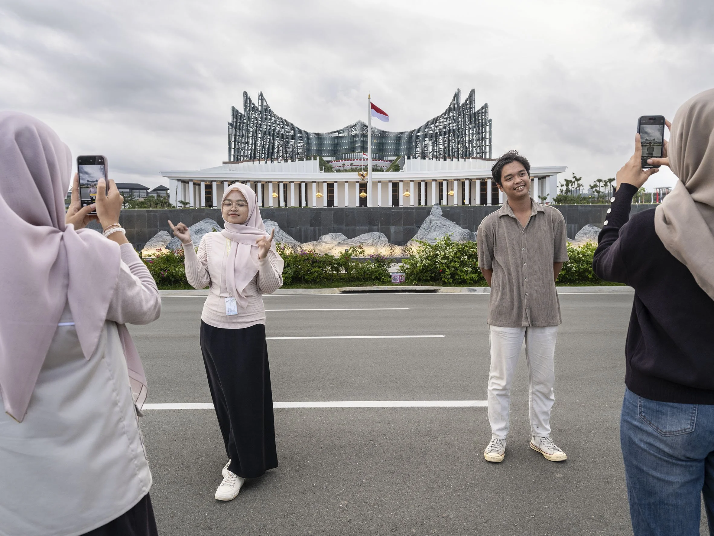 Daytrippers posing in front of the Presidential Palace in Nusantara. August 16, 2025 