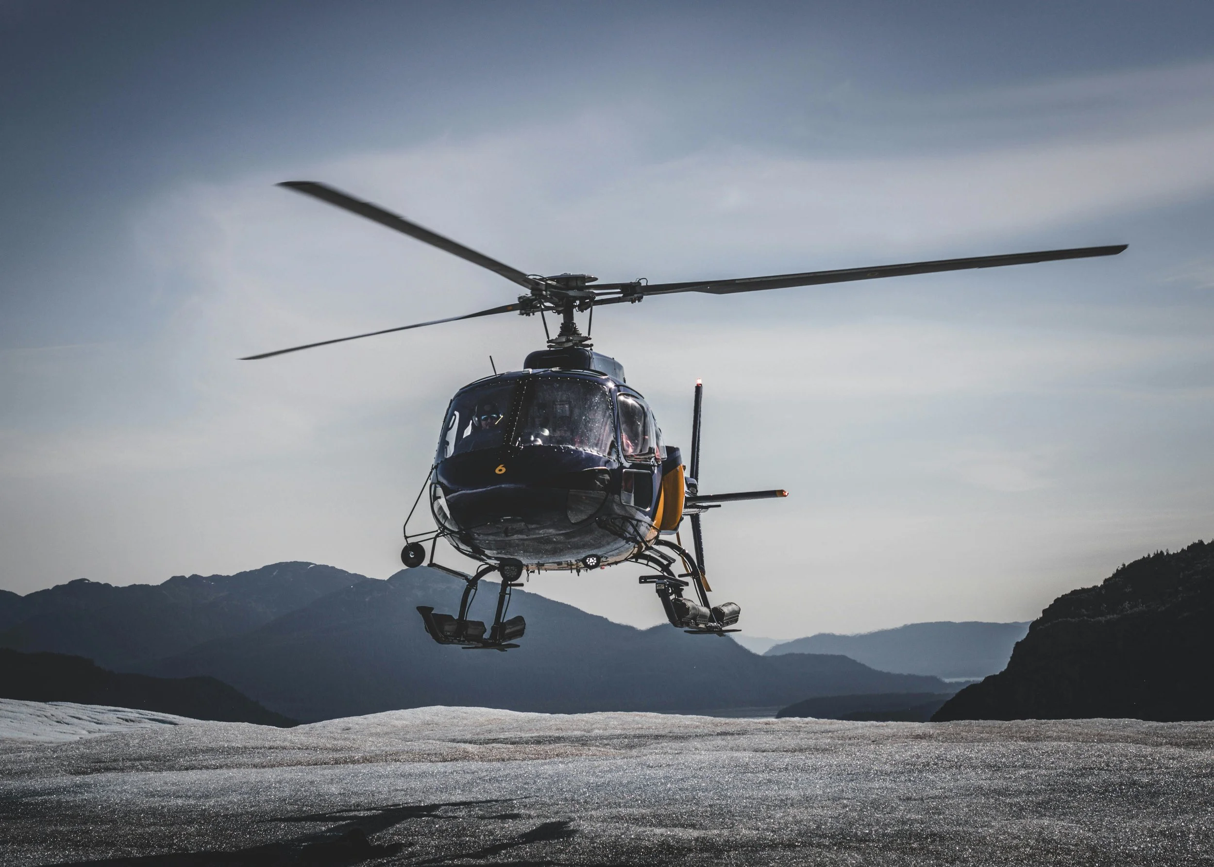 helicopter landing on glacier