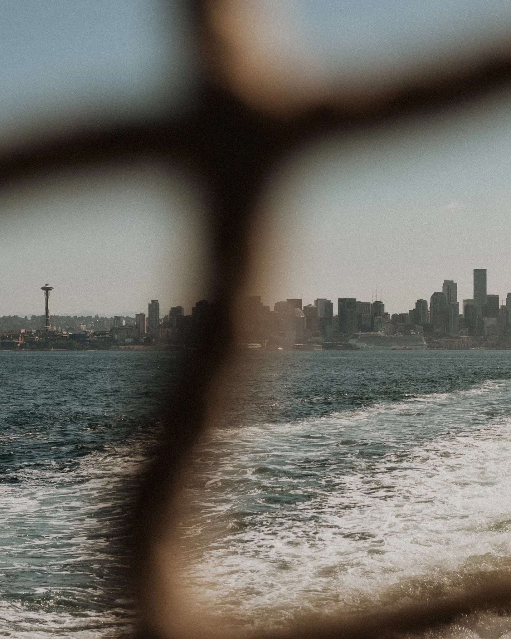 view of Seattle Space Needle from back of a ferry