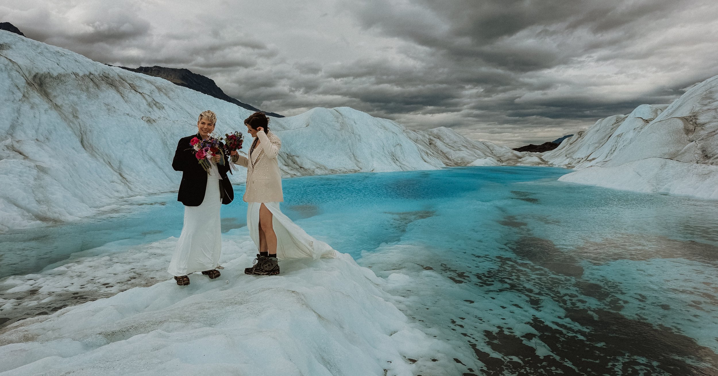 brides exchanging vows on Knik glacier in Alaska